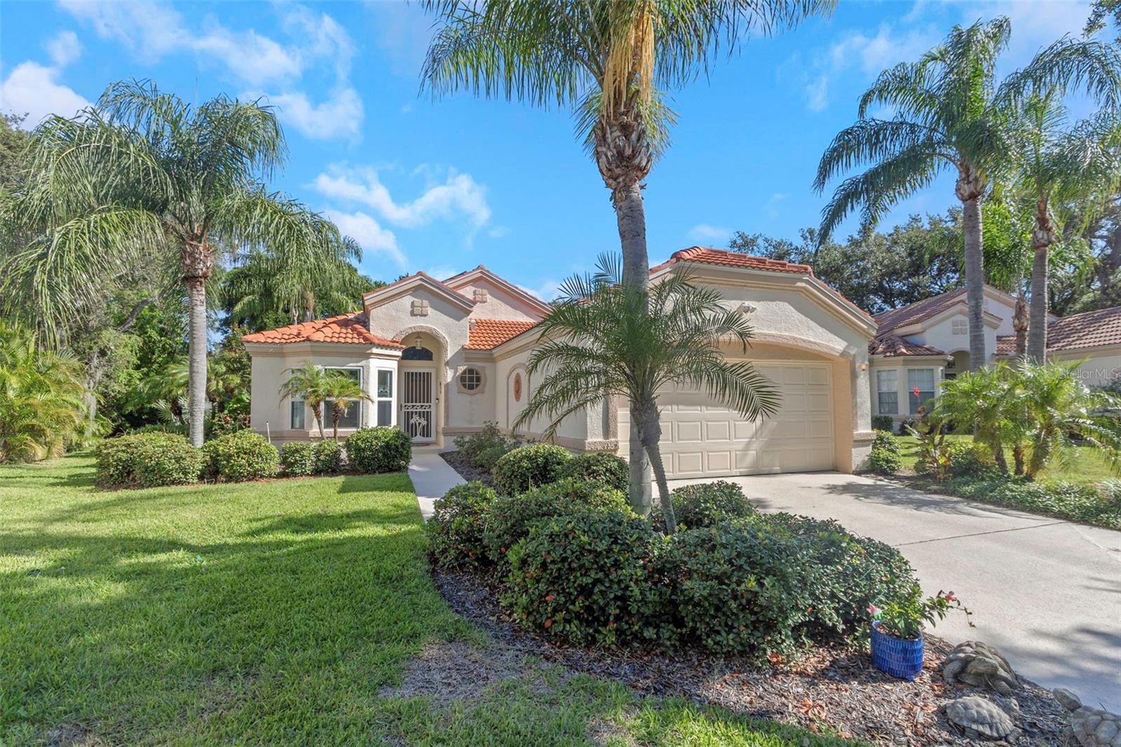 Are you seeking that special home in the quaint community of Westwinds Village in Tarpon Springs? Imagine living at the end of a quiet cul-de-sac abound by a tropical serene setting ready for new owners. This move in ready cozy 2 bedroom, 2 bath home offers everything you need for a relaxed, convenient Florida lifestyle. The kitchen is both stylish and functional featuring beautiful stone countertops, classic cabinetry, stainless steel appliances with a layout perfect for cooking or entertaining. The open airy floor plan with vaulted ceilings enhance the sense of space and natural light throughout the core living areas. Step outside to your screened lanai along with your newly resurfaced in ground pool combined with the oversized deck overlooking the lush backyard dotted within tropical landscaping provides the perfect space for poolside relaxation. The real key to this home is the the location, just a few minutes to Fred Howard Park/Beach, downtown Tarpon Springs with its historic Sponge Docks and endless opportunities for dining, shopping, and entertainment. Easy access to Honeymoon Beach/Caladesi Island, downtown Dunedin and the pure white sands of Clearwater Beach!
