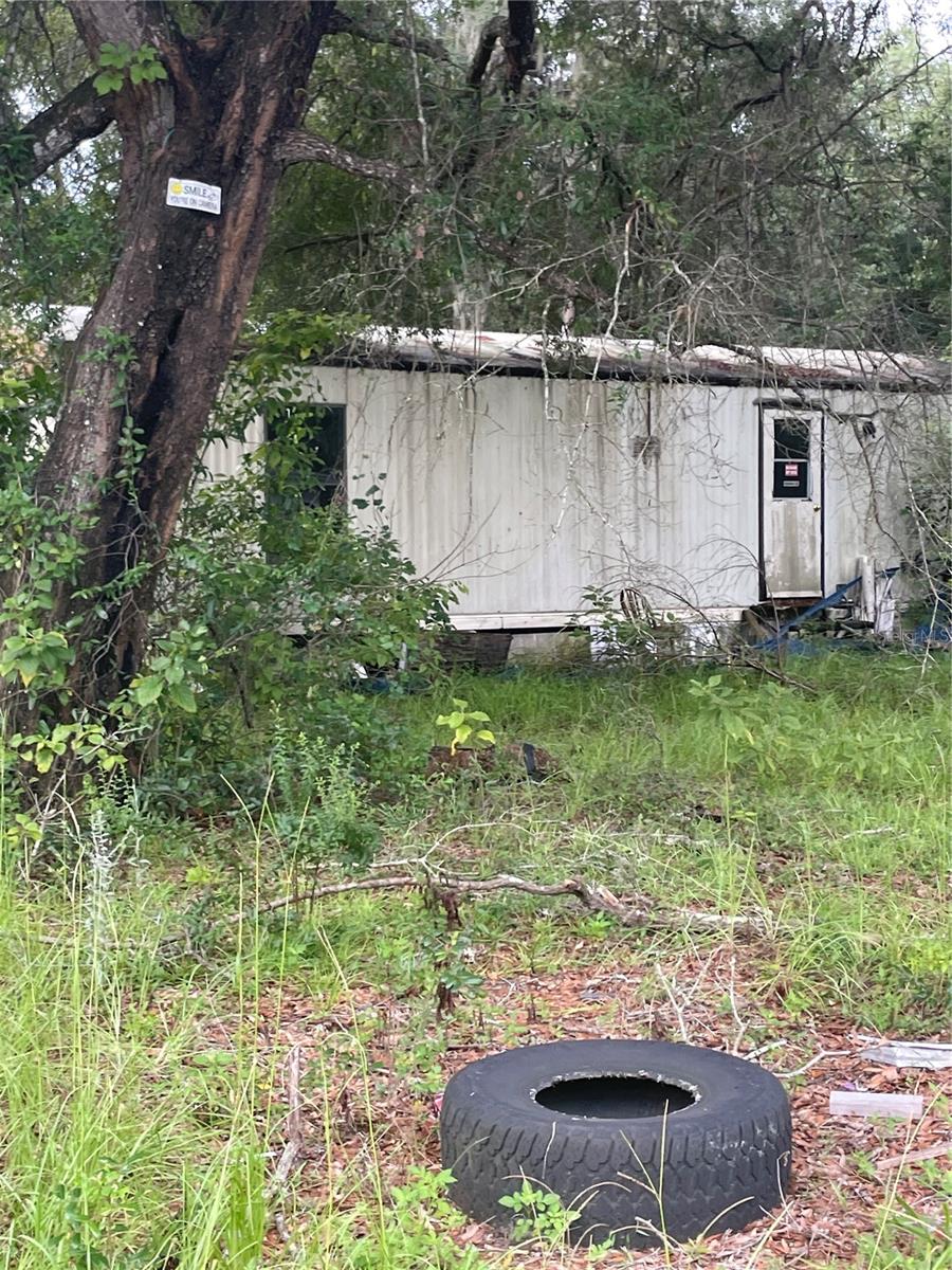 Mobile home on a 1.64 acre, quiet area, with an extra mobile home, great opportunity to fix and rent.