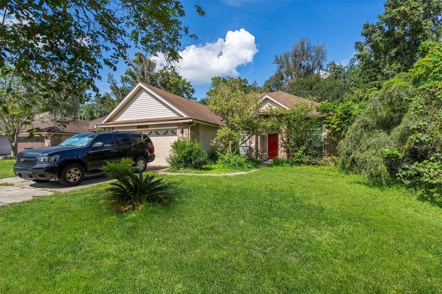 Step into your own private Mandarin retreat at 5351 Oxford Crest Dr! This beautifully upgraded 4-bed, 2-bath, 1,897 sq ft home sits on nearly a ¼-acre preserve lot, offering peace, privacy, and plenty of space to entertain. Inside, you’ll find laminate wood floors, granite countertops, and a cozy fireplace anchoring the open living area. The gourmet kitchen flows seamlessly into a spacious dining and family room, while the split floor plan gives the primary suite extra privacy with its own walk-in closet and spa-style bath. Enjoy Florida living year-round on the screened patio, overlooking fruit trees and lush greenery with no neighbors directly behind you. The 2-car garage, newer upgrades, and low HOA fees (approx. $220/year) make this an unbeatable opportunity. Located minutes from shopping, dining, and top schools—including Mandarin High—you’ll love the balance of suburban convenience and natural serenity. Whether you’re looking for your next dream home, flip, or long-term rental, this one checks all the boxes.