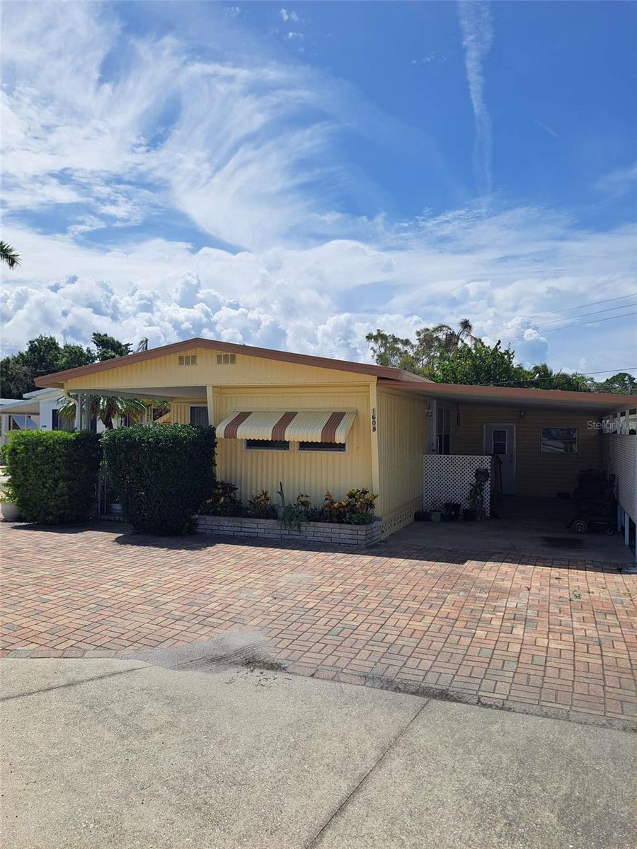 Enjoy the Florida lifestyle in this beautifully maintained mobile home located in a desirable waterfront community! This charming 2-bedroom, 1-bath home offers comfortable living with an open floor plan, spacious kitchen, and a bright Florida room perfect for enjoying your morning coffee or entertaining guests. Situated just steps from the water, this home provides easy access to boating, fishing, and scenic views. The community features a private boat ramp, fishing pier, clubhouse, heated pool, and organized activities for residents. Whether you're a year-round resident or seasonal snowbird, you'll love the relaxed, coastal atmosphere. No lot rent – you own the land! Low HOA fees and a pet-friendly policy make this a perfect blend of affordability and convenience. Close to shopping, restaurants, golf courses, and white sand beaches. Home is not in bad shape for the price but does have a few TLC areas.
Don’t miss your chance to live in one of the area's most sought-after waterfront communities!
Note the half bath is there but has a bookshelf covering it at the moment. This home is wheelchair accessible with a washer/dryer hook up in the shed however there is no washer and dryer present.