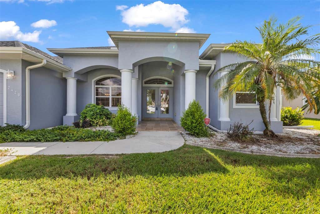 Photo of 2420 Pebble Creek Place, Port Charlotte, FL 33948 (MLS # C7529903)