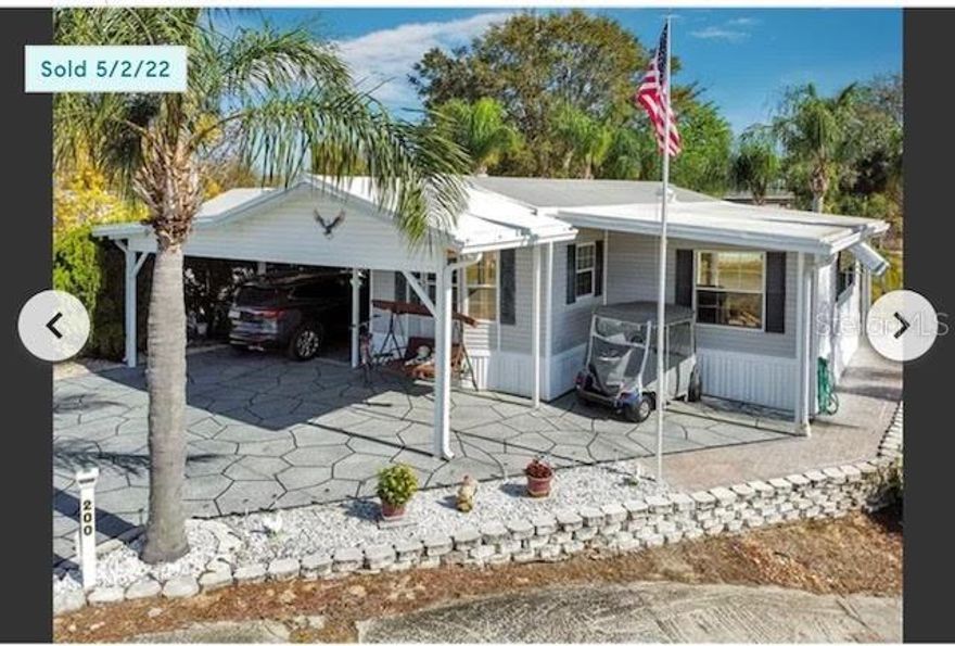 This a 55+ (gated) community. Lovely waterfront 2 bedroom (or den), 2.5 bath home with attached garage & laundry comes fully furnished with fixtures and hangings. The interior home contains a separate living room overlooking the water with a sliding glass door, a formal dining room, & ample kitchen.  The size of the kitchen is all you could want. Plenty of space in this home to entertain or party, but it is cozy enough to rest and relax. This is a split floor plan that separates the master bedroom and bath from the 2nd bedroom/bath creating plenty of privacy for guests. Entering through the carport, the 2nd bedroom/bath is split from the Master with an added generous living room overlooking the beautiful pond with lots of light in the living area. Enjoy the nightly birds and gorgeous sunsets from inside the living room or from outside on the rear porch with an extra large lot and plenty of greenery. 
The built on golf cart garage includes washer/dryer and plenty of room for projects and storage. It also has it's own 1/2 bath. There is a new long concrete seawall with a 10 year warranty.
This friendly community comes with a pool, jaccuzi, game area and multiple community activities. It is turnkey home with dishes,linens, furniture and shopping within a few miles. Hospitals and doctors are close by.
If this is an investment home, HOA requires a one year minimum lease, then the owner pays for garbage and water and the renter would pay gas and electric and application fee.
 You will enjoy this small, but central location.
AS-IS contracts only.