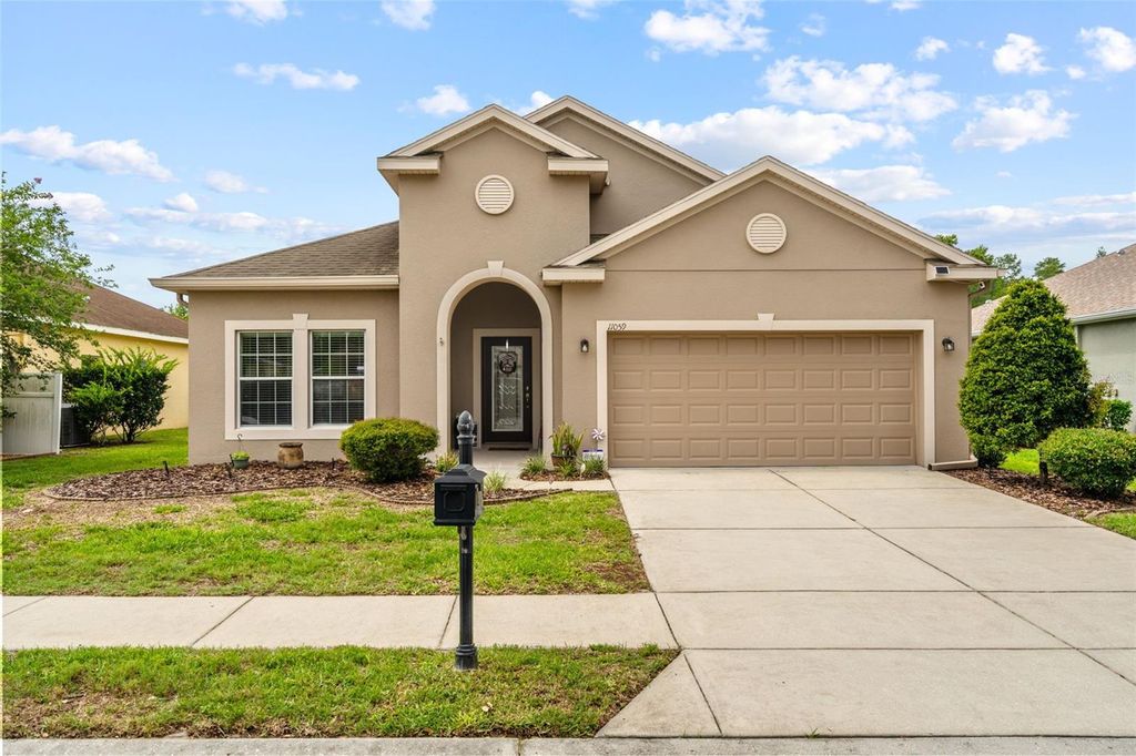 Photo of 11059 Belle Haven Drive, New Port Richey, FL 34654 (MLS # TB8517105)