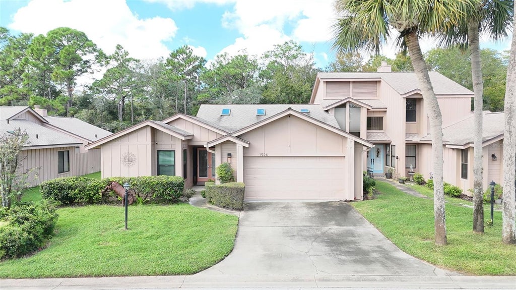 Photo of 1924 Whisperwood Way, Port Orange, FL 32128 (MLS # O6450292)