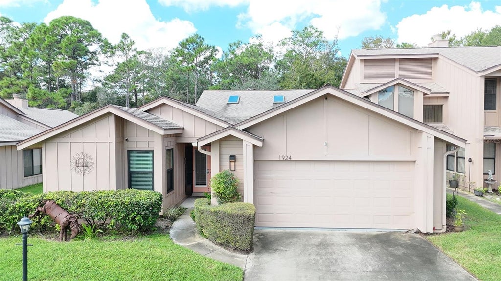 Photo of 1924 Whisperwood Way, Port Orange, FL 32128 (MLS # O6450292)