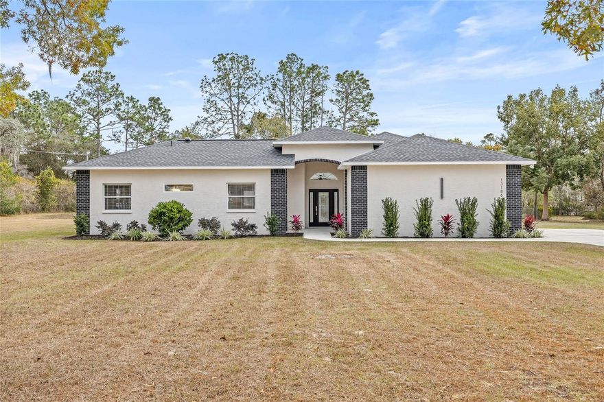 Florida Living is waiting for you! Welcome to your dream retreat--an exquisitely remodeled 5-bedroom, 3-bath cabana-style home set on just over an acre in one of the area's most desirable neighborhoods. Featuring a private courtyard pool, premium upgrades, and an exceptionally flexible layout, this property offers the perfect blend of luxury, comfort, and true indoor-outdoor living. As you walk through the front doors, you're immediately welcomed into the stunning courtyard showcasing an in-ground pool, the captivating centerpiece of the home. The thoughtful cabana-style design allows the pool to be visible from almost every room, creating a tranquil, resort-inspired ambiance throughout. Inside, the open-concept living area feels bright, expansive, and inviting with soaring ceilings, rounded architectural details, and elegant travertine flooring. All of the rooms are gracious in size, providing comfort and functionality for every lifestyle. The entire house has been freshly painted inside and out, giving it a crisp, modern, and move-in ready feel. The heart of the home is the all-new custom kitchen, expertly designed with a massive center island, soft-close cabinetry, dual pantries, a sleek 36-inch flat cooktop, brand-new KitchenAid appliances, and a dedicated beverage cooler. Whether hosting large gatherings or enjoying quiet evenings at home, this kitchen delivers luxury, style, and convenience. This home features five beautifully updated bedrooms and three fully remodeled bathrooms, each showcasing modern, high-end finishes. The primary bathroom is a true spa retreat with a freestanding soaking tub and new double vanities. The cabana bathroom mirrors this luxury with new double vanities and contemporary upgrades--ideal for guests or extended family. For added comfort and efficiency, the home includes dual water heaters, with one dedicated to the primary suite and outdoor shower area. There are also two HVAC units, each featuring a dual media filtration system--one for the main home and one for the cabana--ensuring superior air quality and precise climate control. A brand-new roof was recently installed, providing peace of mind and long-term durability. A side-entrance garage enhances curb appeal and functionality, while a new landscape package adds fresh beauty to the property's exterior. The property also includes an oversized 2-car garage with enough space to comfortably fit a golf cart, adding even more convenience and versatility. Set on just slightly over an acre, the fenced property offers ample outdoor space for entertaining, room for children to play, and plenty of space for pets to roam. There is ample room to add a detached garage or workshop, and more than enough space to store an RV, boat, or recreational toys. With its flexible layout, including a separate cabana suite with its own bedrooms and bath, this home is perfectly suited for multigenerational living if that is a need, offering privacy, comfort, and independence for every member of the household. Additionally, the layout makes this property a fantastic opportunity for an Airbnb or vacation rental, with endless potential. With a fully remodeled interior, brand-new roof, freshly painted inside and out, and a design centered around the serene courtyard pool, this home is truly move-in ready. Beautifully transformed and thoughtfully reimagined, this cabana-style gem offers luxury, versatility, and exceptional living--your dream retreat awaits.