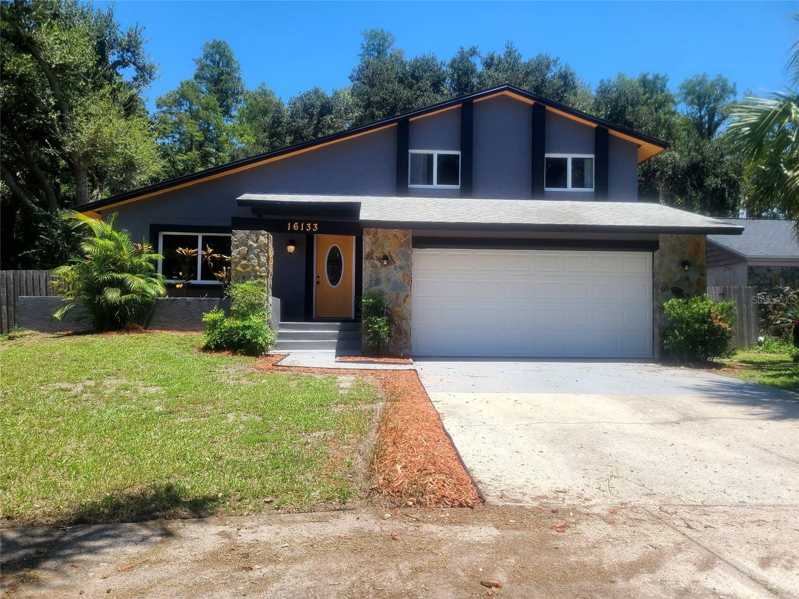 TOTAL REMODEL / CARROLLWOOD CONSERVATION on 1/3 Acre LOCATION. Want New? Want Seclusion? Want Energy Efficient? Want Carrollwood? THEN THIS IS THE HOME!........Driving Up you Notice the Snappy Color Sceme. (Like the Colorado Mountain Homes) ....HOME Sits On a Pie-Shaped (1/3 Acre) Yard.... Notice the NEW DOUBLE Pane Windows thru-out, ... Entering the Home and be amazed at the Huge 33' x 22' Great Room w/ Cathedral Ceilings that Joins the NEW Open Kitchen. The Kitchen Has been Remodeled with Hard-Wood Cabinets, Breakfast-Nook Bar(Seats 6+) to Entertain Guests or Eatertain Dinner Parties. All New Lighting, Fresh Paint & New Laminated Wood Flooring. All New Appliances, Range, Refrigerator, Microwave, Washer & Dryer are included as well. You've Got to See the CUSTOM Marbel Styled Counter-Tops Island. The Chef of the Home will Be Amazed and Feel like the Captain of the Ship Split Bedroom Plan with the Primary Bedroom Down Stairs and the 3 others up. SOLAR ELECTRIC ASSIST.... :"Totally Paid For". The Roof is approx 5 yrs old. The Heat-Pump A/C is a 18 Ser that's less than 3 yrs. So Come Enjoy a Solar Assisted, Energy Efficient Conservation Lot Totally Remodeled. The Homes hasa (12' X 22')Bonus Room w/A/C for a Patio Room or Man Cave. The back yard is so sereal.....Take Look, You'll be Amazed that this Yard and this House sits in Carrollwood. Seller had to relocate & Never got to Enjoy the Re-Hab. Vacant & Ready for You. (MORE PHOTOS TO COME)