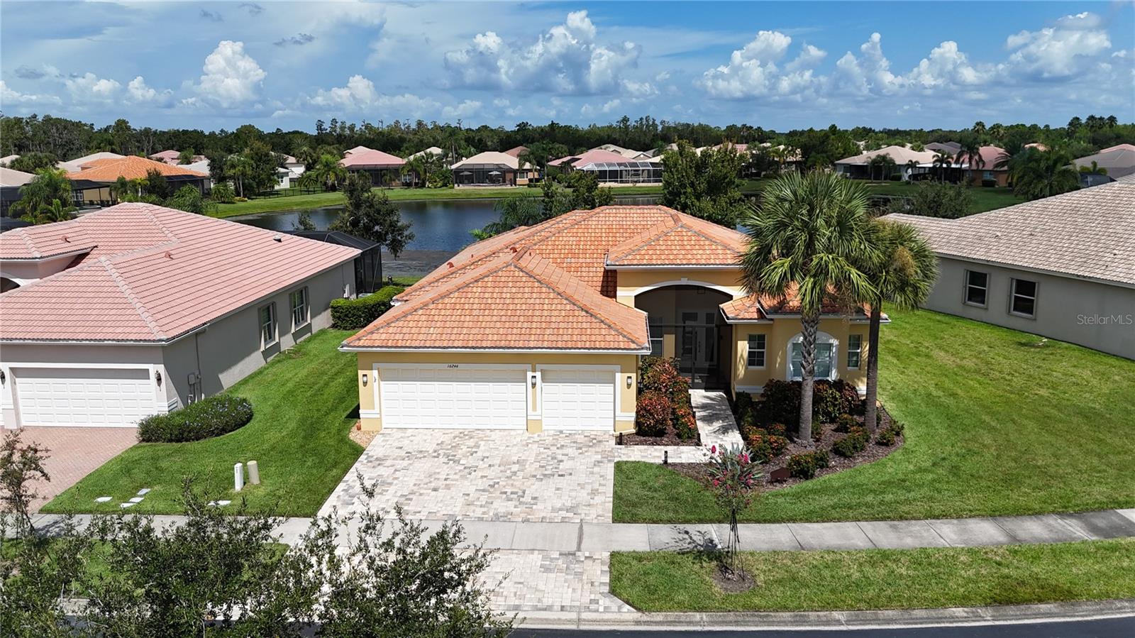 Price reduced for a quick sale!! Captivating Home in Valencia Lakes - A 55+ Resort-Style Haven! Welcome to your dream retreat in the heart of Valencia Lakes! This stunning 3 bedroom, 2 bathroom home boasts breathtaking water views that greet you upon entry. The spacious kitchen seamlessly flows into the living area, perfect for entertaining, while a cozy sitting room offers a serene escape. Step outside to your expansive screened-in lanai, recently upgraded to provide the ideal space for outdoor gatherings, all overlooking a picturesque pond. Inside, enjoy the elegance of large tile floors, a generous master suite with dual vanity sinks, and thoughtfully designed custom closets. Recent enhancements include modern over and under cabinet LED lighting, new ceiling fans, and fresh interior paint ensuring a bright and inviting atmosphere. The AC is only 2 years old, and a new dishwasher and built-in oven means you can relax and enjoy your new home without worry. Additional updates include new driveway pavers, exterior paint, garage floors professionally epoxied, custom window treatments in the living, dining room and eating area, new landscaping, grab bars in the shower and a reverse osmosis water filter. Nestled within one of the most vibrant 55+ communities in the Greater Tampa Bay area, Valencia Lakes offers a resort-style lifestyle with a 40,000 sq. ft. clubhouse, 24-hour fitness center, multiple pools, tennis courts, bistro, pickleball, bocce ball, live shows, arts and crafts, cooking classes, walking paths , numerous clubs and activities to keep you engaged. Don’t miss the chance to experience this active lifestyle – schedule your tour today!
