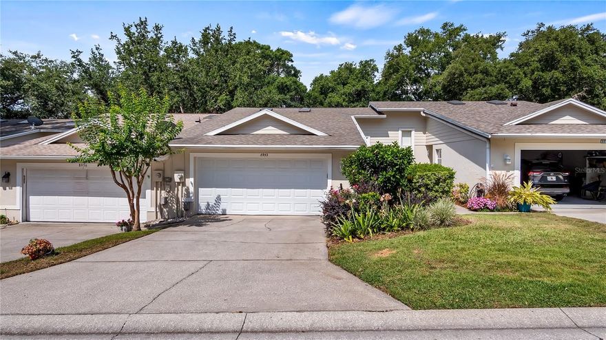 Beautiful townhome in Green Valley, peaceful views out the backyard. Front door with beveled glass leads you into this warm home that has two bedrooms, two baths and a family room just off the huge great room. The kitchen has been updated with granite countertops and breakfast bar, under-mount sink, and all stainless steel appliances including refrigerator. The pantry is a great storage space in addition to all the wood cabinets. As the kitchen opens to the great room with vaulted ceiling, you have an amazing living and entertaining space! The dining area in the great room can be as large a space as needed, or perfect for a casual dining table. The wall space is tremendous for a sectional couch, and the cabinet on the opposite wall is perfect for the entertainment center and storage. The family room is also just off the great room and has a wall of windows looking out over the rear yard. The master bedroom is a nice size, also has that window looking out back, a bath with double sinks, granite countertops, glass-enclosed shower and large walk-in closet. The guest room has nice storage as well, and the second bath has the shower/tub and the glass enclosure. Two-car attached garage with painted floor, door opener, shelving and a laundry sink, plus is oversized for a longer vehicle. Just down the block is a community clubhouse, pool and tennis courts, just for the townhome community use! The HOA fee covers all the lawn care as well, so low-maintenance living here! Surrounded by large trees, there are plenty of shaded areas up and down the street and in the backyard. Semi-private golf course community with affordable golf rates or memberships! Fantastic location within 2-minute drive to the Publix shopping center which also has restaurants, and other retail and services nearby. If you are interested in the South Lake Trail, this is also just blocks away - it leads around the lake and down to the revitalized downtown Clermont area. The weekend events including First Friday Food Trucks, Sunday farmers market, plus all the restaurants, breweries, shops and services, including live music, ice cream and just sitting by the lake watching the sunsets across Lake Minneola. This is an amazing home, ready to go. New roof in 2017, new AC in 2008 and a whole-house plumbing re-piping in 2021! Please watch the interior/drone video then make your appointment to come see this ready now townhome!