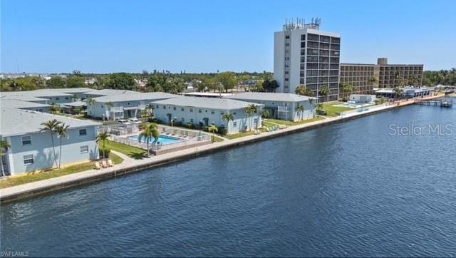 Look no further—this beautifully waterfront condo home can be yours! This recently remodeled 2-bedroom, 1-bath corner condo offers everything you’ve been searching for, including an additional interior storage room for added convenience. Located in the desirable Palms at Waters Edge community in North Fort Myers, this home features an updated kitchen with solid surface countertops, stainless steel appliances, and modern cabinetry. The bathroom has also been upgraded with a stylish vanity and tile-surround shower. Fresh interior paint and new flooring throughout complete the refreshed look. Enjoy serene riverfront views while lounging by the water or relaxing in the community pool. Just minutes from Downtown Fort Myers, you’ll have easy access to dining, nightlife, and year-round special events—whether by car or trolley. This is the perfect combination of price, location, and lifestyle. Easy to see - book your showing today!
