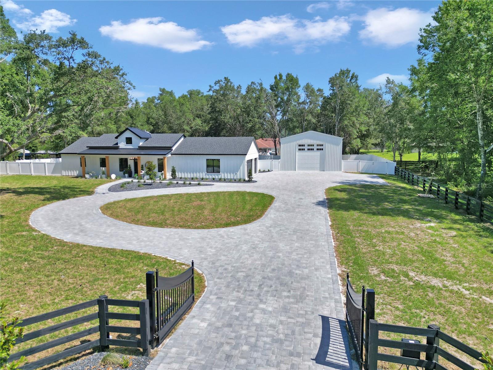 Welcome to your dream retreat—this stunning 3 bedroom, 2 bath farmhouse-style home sits on over an acre of beautiful countryside, just minutes from world-class horse properties. Step inside to soaring ceilings, an open-concept layout, and designer upgrades throughout. The heart of the home is a white and bright gourmet kitchen with quartz countertops, soft-close cabinetry, and a spacious island perfect for entertaining. All z line black and gold appliances with amazing stove and decorative hood. This kitchen is a dream.
The primary bedroom features wall accents and large ceiling fans. The primary bathroom features floor to ceiling lighting, sliding custom barn door and lighted mirrors with upgraded tile throughout. Enjoy the free standing tub and no shower glass door so no mess.
Each additional bedroom has beautifully done wall accents and ceiling fans including an upgraded tiled bath/shower combo with glass door and lighted mirrors.
Enjoy seamless indoor-outdoor living with large windows flooding the space with natural light, and a generous 3-car garage offering plenty of room for vehicles, toys, or a workshop. The garage is fitted with a ac splitter so you can enjoy the 3 car garage during the summer months as well.
With no HOA and all the peaceful perks of rural living—plus modern luxury finishes—this home is the perfect blend of function, style, and serenity. In addition a 50x30 Metal Shop with 14 foot garage door and access for water, septic , and electric. Perfect to have on the property for you to have all your toys on your land no need to pay for storage or build your own shop. Enjoy the amazing front circle driveway with plenty of space and all pavers.
Schedule your private tour today and experience country living with a fresh, modern twist!