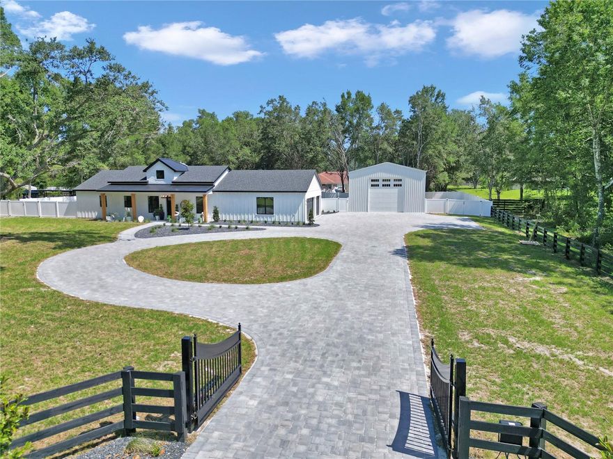 Welcome to your dream retreat—this stunning 3 bedroom, 2 bath farmhouse-style home sits on over an acre of beautiful countryside, just minutes from world-class horse properties. Step inside to soaring ceilings, an open-concept layout, and designer upgrades throughout. The heart of the home is a white and bright gourmet kitchen with quartz countertops, soft-close cabinetry, and a spacious island perfect for entertaining. All z line black and gold appliances with amazing stove and decorative hood. This kitchen is a dream. 

The primary bedroom features wall accents and large ceiling fans. The primary bathroom features floor to ceiling lighting, sliding custom barn door and lighted mirrors with upgraded tile throughout. Enjoy the free standing tub and no shower glass door so no mess. 

Each additional bedroom has beautifully done wall accents and ceiling fans including an upgraded tiled bath/shower combo with glass door and lighted mirrors. 

Enjoy seamless indoor-outdoor living with large windows flooding the space with natural light, and a generous 3-car garage offering plenty of room for vehicles, toys, or a workshop. The garage is fitted with a ac splitter so you can enjoy the 3 car garage during the summer months as well. 

With no HOA and all the peaceful perks of rural living—plus modern luxury finishes—this home is the perfect blend of function, style, and serenity. In addition a 50x30 Metal Shop with 14 foot garage door and access for water, septic , and electric.  Perfect to have on the property for you to have all your toys on your land no need to pay for storage or build your own shop. Enjoy the amazing front circle driveway with plenty of space and all pavers. 

Schedule your private tour today and experience country living with a fresh, modern twist!