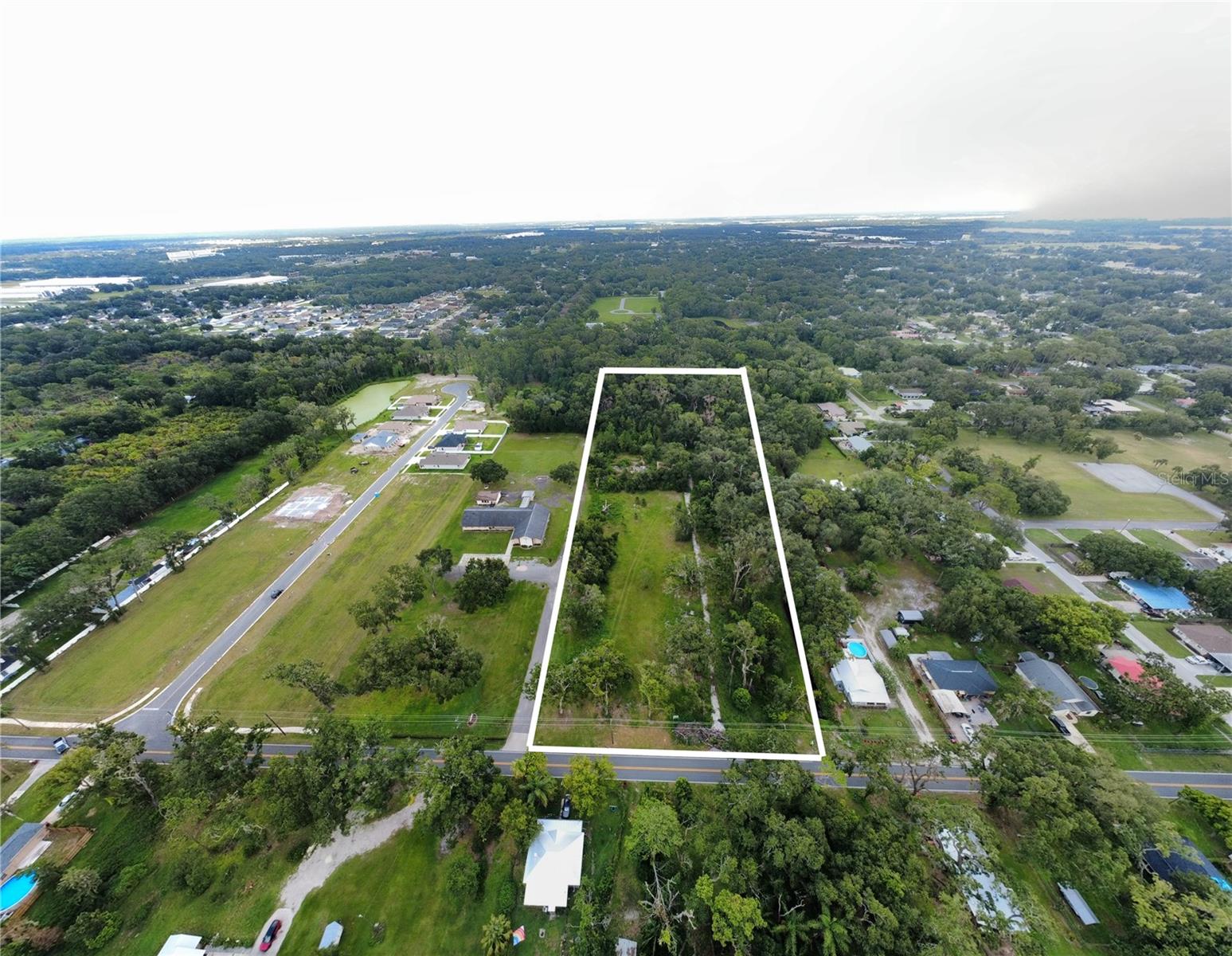 Prime 6.26 acre residential development site within Plant City limits. Zoned R-1A, current zoning allows up to 22 single-family lots. Conceptual layout supports up to 17 lots on approximately 4.69 upland acres. Exceptional opportunity for developers in one of Hillsborough County’s fastest-growing corridors. See attachment for site plans and survey.