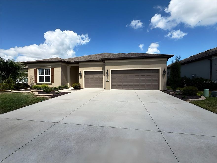 ESCAPE TO YOUR OWN PRIVATE HOME PARADISE! Located in beautiful Del Webb Stone Creek! This Renown 2022 model has everything a luxury home gives. PRIVATE SWIMMING POOL WITH A SPECTACULAR GOLF COURSE VIEW, not to mention the rocky dry retention area beyond the golf course WOW! This spacious home checks all the boxes. Exterior has upgraded coach light on timers, glass insert on the front door with Wi-Fi keypad lock and professionally landscaped. The exterior front home window has custom crowning and shutters, giving it that special touch. The home opens up into a nice foyer entry, the dining, living room and open floor plan kitchen makes you feel right at home. Extra quiet newer dishwasher, composite sink with touchless faucet, soft close doors and alluring quartz countertops and auto sensor lighting for the big pantry. Fans in every bedroom and family room,  Immediately feel the luxury vinyl plank flooring throughout, split floor plan with 2 bedroom guest suites for a total of 3.5 baths. Master bedroom provides two large walk in closets and doorway right into the laundry room, which can also be accessed from the garage open entry. Motion lights have been added in the laundry room, and master bedroom, never be in the dark. You will love the auto powered window blinds in the master bedroom, flex room, dining, cafe and family rooms. Windows facing east and west have been improved Lexan panels on East and West windows only. This home has rounded walls with a warm all home color. Enjoy the cleanest water with a whole home Eco-water filter and softener in addition to the reverse osmosis kitchen water filter. Walking through the sliding doors into your private pool area, giant birdcage and outdoor kitchen with grill. The pool is heated by electric, auto cleaner and auto fill and drain technology. In the evening the view is even prettier with pool lighting and fans, all great for entertaining or just relaxing. The three car garage has plenty of room for vehicles, golf cart and storage, if that is not enough, there is already a garage storage rack in place, garage floor has vinyl tiles and garage door is insulated. Irrigation is controlled with the newest wi-fi electronics that can be operated from your phone. This home has so many upgrades during the building and after. There is nothing for you to do but move in and relish everything that makes life easier. This is a golfers dream home or if you are looking for a private homesite with nothing to look at but green space, with woods and bolder rocks. This community offers many amenities, clubs, activities and has an on property restaurant. Golf carting is fun, go listen to music at the town square and have access to three shopping plaza's with doctors, additional places to eat, go to the dentist and visit three different grocery stores. You can even golf cart to the post office. There are NO homesites like this one! Come and enjoy your best life! More pictures coming soon!
