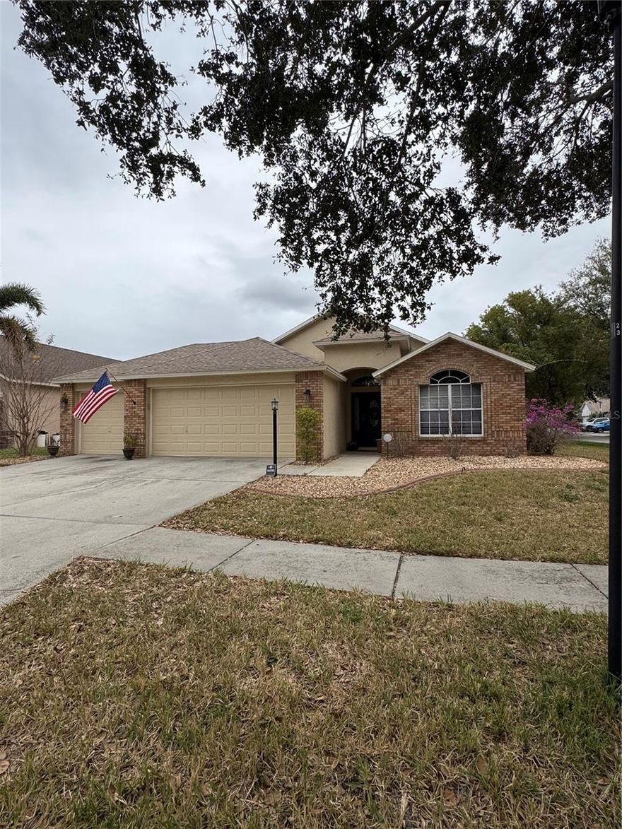 LIMITED LISTING- Welcome to this beautifully maintained 3-bedroom, 2-bath, 3-car garage home, located in the amenity-rich community of Lake St. Charles. Offering 1,825 square feet of thoughtfully designed living space, this home combines comfort, flexibility, and peace of mind. Major updates include a NEW A/C (September 2023) with antimicrobial UV light, NEW ROOF & EXTERIOR PAINT (July 2021), and vinyl privacy fencing enclosing the entire backyard and side yard. The home is also equipped with wirelessly controlled security, smoke detectors, lighting, and more. The spacious interior features a desirable split-bedroom floor plan, with two bedrooms and a full bath at the front of the home and a generous owner’s suite privately situated at the rear. The owner’s suite boasts a large walk-in closet with motion-activated lighting and a spacious en-suite bathroom featuring dual vanities with Corian countertops, a soaking tub, walk-in shower, and water closet.

At the heart of the home, the open living room and kitchen create an inviting space for everyday living and entertaining. The kitchen showcases an authentic brick hearth as its focal point, surrounding the glass cooktop, built-in stainless-steel oven, and microwave. Additional highlights include abundant wood cabinetry, a large walk-in pantry with hands-free access, stainless-steel side-by-side refrigerator, dishwasher, and a breakfast bar overlooking the living area. The adjacent breakfast nook comfortably accommodates seating for six.

A flexible Florida room/bonus space at the back of the home opens to both the living area and owner’s suite, making it ideal for a home gym, office, playroom, or game room (small pool table included).

The laundry room, complete with newer full-size washer and dryer, connects the kitchen to the garage and can be discreetly closed off with a pocket door. The roomy 3-car garage includes a convenient utility sink—perfect for projects and outdoor cleanup.

Lake St. Charles offers outstanding amenities including a community pool, kiddie pool, hot tub, tennis and basketball courts, baseball and soccer fields, dog park, and a 2.5-mile trail around a scenic 70-acre lake with exercise stations. Enjoy low HOA fees and a prime location with easy access to I-75, the Selmon Expressway, Tampa International Airport, MacDill AFB, and more.

A fantastic opportunity in a well-established community—don’t miss it!