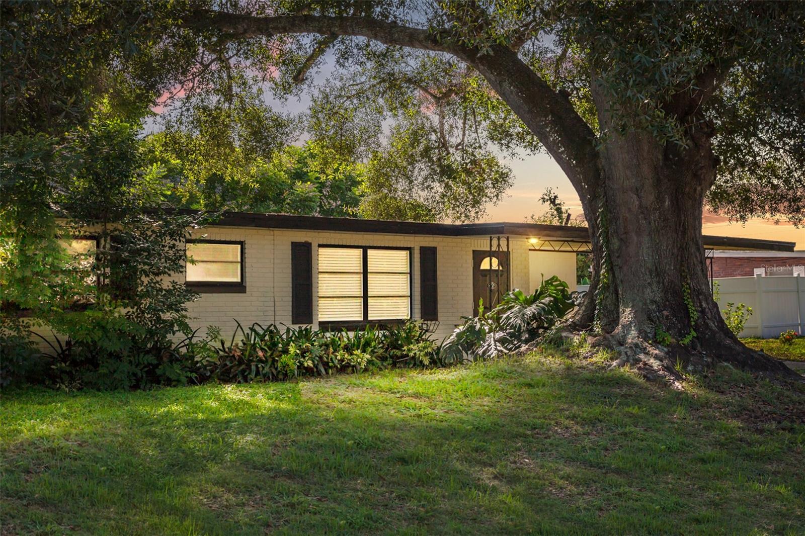 Welcome to 29 Lamplight Lane in Winter Haven—an ideal first-time buyer’s home with 3 spacious bedrooms, 2 bathrooms, and no HOA! This move-in ready residence sits on just under a quarter acre with mature landscaping and a fully fenced backyard, perfect for pets or outdoor entertaining. Inside, you’ll find a large living room with updated laminate flooring, a beautifully upgraded kitchen with stainless steel appliances, and generously sized bedrooms all with modern flooring. Enjoy year-round comfort on the screened patio with its own AC unit. A new roof (2019) provides lasting peace of mind. Conveniently located near the Chain of Lakes, LEGOLAND®, and Winter Haven’s lively downtown filled with shops, restaurants, and breweries, this home also offers easy access to major roadways, transit, and nearby Lakeland and Orlando attractions. A rare find—affordable, updated, and brimming with lifestyle perks!