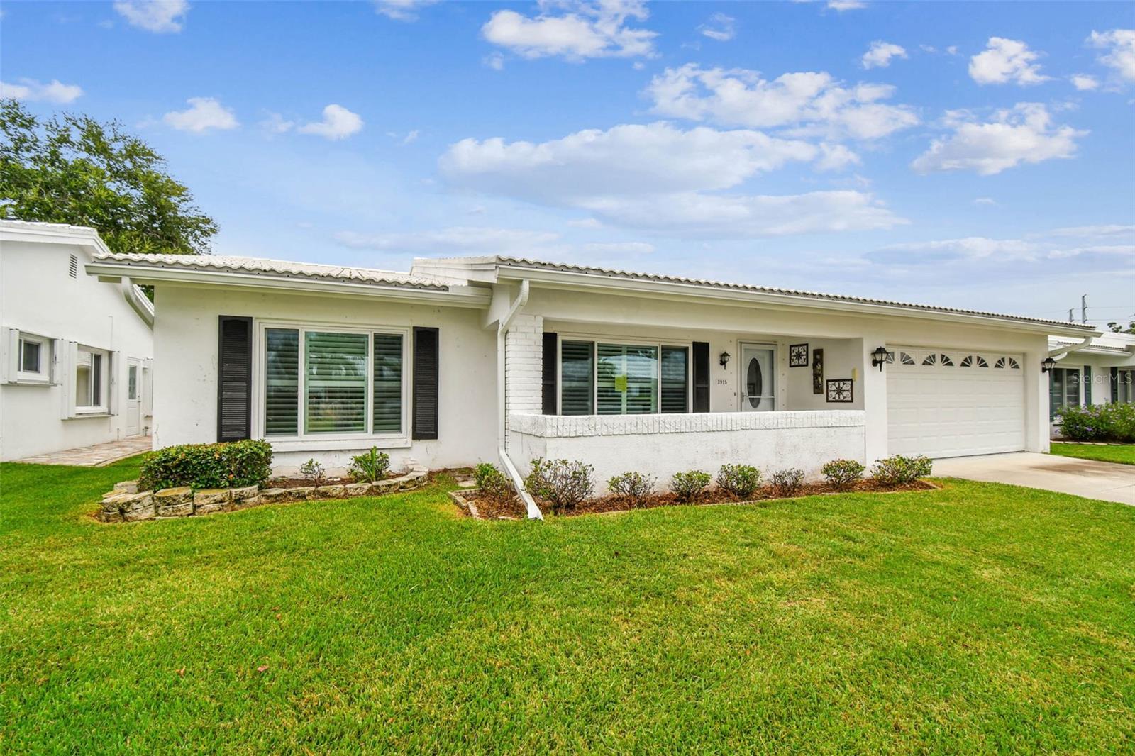 Welcome home! This beautifully updated and well-maintained property is truly move-in ready. The spacious open floor plan is perfect for entertaining or casual family gatherings.
The kitchen features stainless steel appliances, a large pantry with laundry, and a convenient pass-through to the family room. There are 2 bedrooms, 2 full baths, plus a versatile study/den just off the family room. The living and dining room combination is accented with gorgeous wood flooring—easy to clean and perfect for everyday living.
Both bedrooms offer roomy walk-in closets, while the primary bath includes a walk-in shower. The guest bath features a walk-in shower also. Additional highlights include: HVAC (2017), Water Heater (2025), Roof (2022), updated kitchen, windows, doors, light fixtures, vertical blinds, plantation shutters, and more. 2-car garage with opener and pull-down attic access.
Located in an active 55+ community, you’ll enjoy a clubhouse, heated pool, shuffleboard courts, golf course, and a full calendar of activities. Shopping, dining, banking, and healthcare are just minutes away—with easy access to Downtown St. Petersburg, Tampa, two international airports, and only 30 minutes to award-winning Gulf Coast beaches!