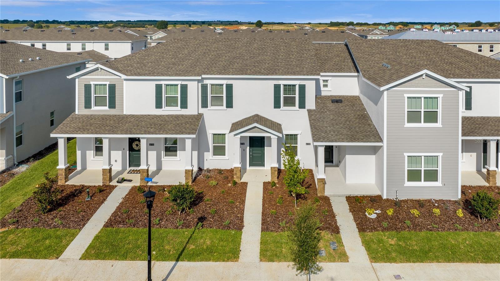 This magnificent two-story townhome offers three bedrooms, two and a half bathrooms, and a convenient two-car rearload garage. The front door opens to a spacious, open-concept living room and dining room combination, perfect for entertaining and family gatherings. The fully equipped kitchen leads to an enticing patio, ideal for outdoor relaxation. Enjoy the convenience of a laundry room completewith a washer and dryer. The lovely upstairs master suite boasts a private bathroom and a roomy walk-in closet. Every home comes with new appliances, blinds, and advanced home automation features like key less door locks and video doorbells. Located in Wellness Ridge, residents cantake advantage of a resort-style swimming pool, an extravagant clubhouse with a state-of-the-art fitness center, and courts for tennis, basketball, and pickleball. Beautiful walking trails weave throughout the community, offering plenty of opportunities to enjoy the outdoors. Closeto Lake Louisa State Park, enjoy hiking, camping, fishing, and kayaking. Pick fresh blueberries, fruits, and vegetables at Southern Hill Farms. Conveniently located near major roadways and theme parks.
What are you waiting for? Call and make an appointment today!