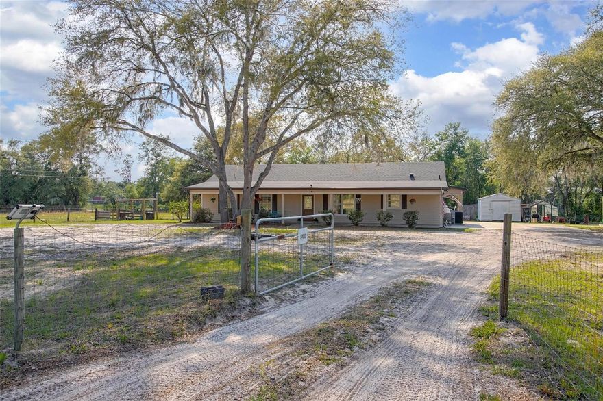 Spacious 4-bedroom, 2-bathroom ranch-style home situated on 2.54 fully fenced acres in DeLeon Springs. This well-maintained property offers 2,074 sq ft of living space with vaulted ceilings and an open layout. Split bedroom floor plan with a large primary suite featuring a walk-in closet and double shower. Kitchen includes ample cabinetry, counter space, and breakfast bar. Enjoy outdoor living with a full-length front porch, deck, and above-ground swimming pool. Property includes a pole barn and a storage building, providing excellent space for equipment, hobbies, or storage. A Paddock area suitable for animals or hobby farming. Additional features include irrigation system, and mature oak trees offering shade and privacy.
Conveniently located with easy access to town, shopping, schools, and DeLeon Springs State Park. Ideal for buyers seeking space, privacy, and a country setting with modern comforts.