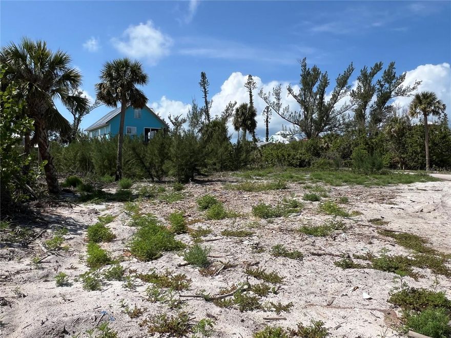 This large 100’ x 122' lot is located on Little Gasparilla Island, a bridgless barrier island off the Cape Haze Pensulia and is only accessible by private boat or water taxi. This lot is third back from the gulf. Being approximately 400’ away from the blue green water you’ll be able to hear the waves lapping at the shore, feel the soft tropical breezes, and have potential views of the water from your future home. This lot is behind the costal construction control line so no state variance is needed. If you are looking for a quiet and relaxing place to get away, you need to come see the island and feel the stress of the mainland start to slip off your shoulders. Little Gasparilla Island doesn’t have any grocery stores, restaurants, or shops but we have 3 ½ miles of uncrowded beach to wander on and collect seashells and shark’s teeth, swim, or sit with a good book and soak up the sun. There is great fishing in the surrounding waters for redfish, snook, snapper, trout and more. By water there are many wonderful restaurants to cruise to. Once your island dream home is built you can start enjoying all the amazing beauty of the island, one of which is watching the fabulous sunsets each evening. You can also drive your golf cart around the island and meet all the friendly neighbors. King St runs east to west; the community dock is on the east side and the beach access is on the west. The community dock, which is first come first served, was damaged by the recent hurricanes and the dock association is in the process of having the dock rebuilt. This lot will need to join the dock association, then the yearly fee is $250.
