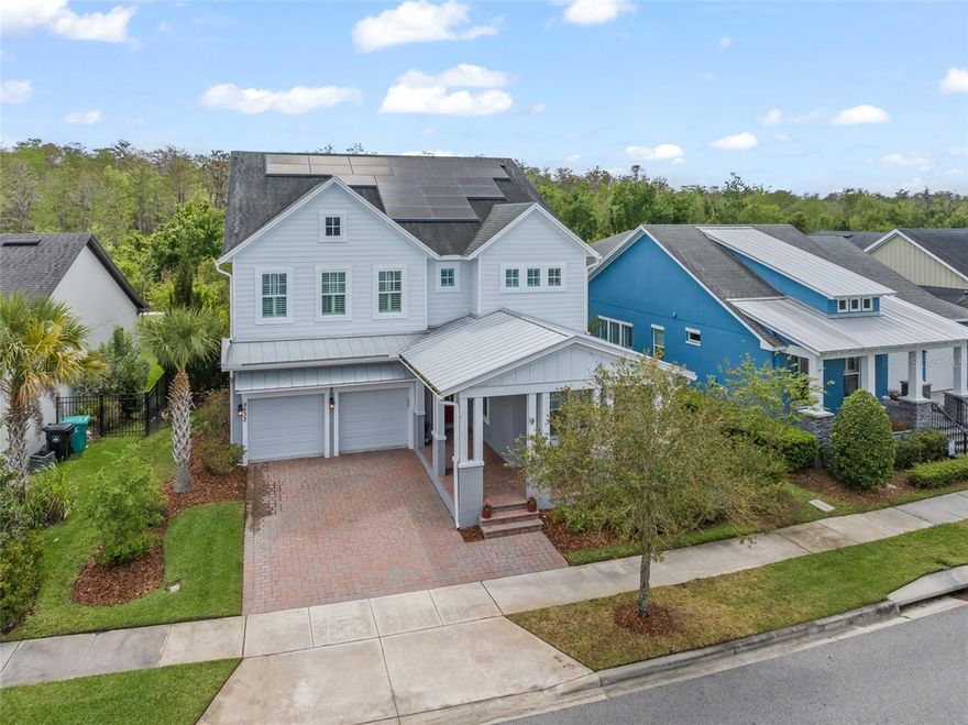 Welcome home to this custom designed home on Conservation lot in Laureate Park, one of Lake Nona’s most sought-after communities. This stunning Ashton Woods Homes St. Lawrence floor plan offers 5 bedrooms, 4.5 bathrooms, formal dining space, and an impressive two-story great room, all complemented by a Tesla solar system with Powerwall backup. From the moment you enter, you’ll notice the abundance of natural light that fills every corner of the home, enhancing the open and airy feel throughout. The main living area is highlighted by a custom accent wall, adding a designer touch and focal point to the space. The thoughtfully designed floor plan flows seamlessly, ideal for both everyday living and entertaining.The main level features a private en-suite guest bedroom, a flexible dining or lounge space, and a grand gourmet kitchen that leaves nothing to be desired. Outfitted with floor-to-ceiling custom cabinetry, quartz countertops, tile backsplash, built-in ovens, a butler’s pantry, wine bar, and a custom walk-in pantry, this kitchen is truly the heart of the home. Newer engineered hardwood floors run throughout, tying the space together with warmth and sophistication. The oversized island overlooks the expansive two-story great room, where walls of windows showcase serene conservation views and bring in incredible natural light. Step outside to the expanded, screened lanai—perfect for relaxing or entertaining—overlooking one of the largest and most private backyards in the neighborhood. The setting is peaceful and serene, with ample space to design and build a custom pool and spa, creating the ultimate outdoor retreat. Upstairs, you’ll find three additional bedrooms and bathrooms, along with a luxurious primary suite featuring abundant windows, dual vanities, a custom super shower with designer tile, rain shower head, and built-in closets. This home also includes a fully paid off full Tesla solar system with three Powerwalls, offering energy efficiency and peace of mind. Located in the heart of Laureate Park, residents enjoy A-rated schools, included Gigabit fiber internet, and a vibrant lifestyle with over 40% green space, multiple parks, resort-style pools, a fitness center, and the popular Canvas Restaurant & Market. Just minutes from Medical City, the VA Hospital, USTA, KPMG, shopping, dining, and all that Lake Nona continues to offer, this home is the perfect blend of luxury, functionality, and location.