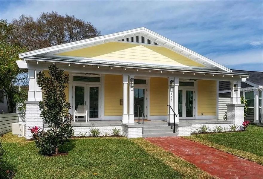 Ideally situated, just moments away from the vibrant cultural and entertainment hub of Downtown St. Pete, as well as the renowned Gulf Beaches. Built in 2020. Upon entry, you are welcomed by a seamless open concept, accentuated by 10'8" tray ceilings, expansive windows, sleek porcelain floors, 8-inch baseboards, and crown molding throughout. The heart of the home is a stunning Chef's kitchen, boasting a generous stainless dual-fuel gas stove, a farmhouse sink, and an impressive waterfall island. The master bedroom and bathroom exude luxury, featuring a roll-in shower, a spacious designer tub, and a well-appointed walk-in closet. Step outside to discover the charm of large, covered front and rear porches that overlook the fenced backyard. A 21 ft sliding rear gate allows for private parking on a 2-car parking pad. This newer construction ensures a comfortable, low-maintenance lifestyle, with a raised concrete foundation, soundproof insulation in interior walls, double-pane impact resistant doors and windows, a tankless on-demand gas water heater, energy-efficient LED lighting throughout, non-invasive mounting of interior plugs and outlets, and a double-stage water conditioner and filtration system. The R35 ceiling insulation further enhances the home's efficiency. Don't miss the opportunity to experience the allure of this beautiful home – schedule your viewing today!