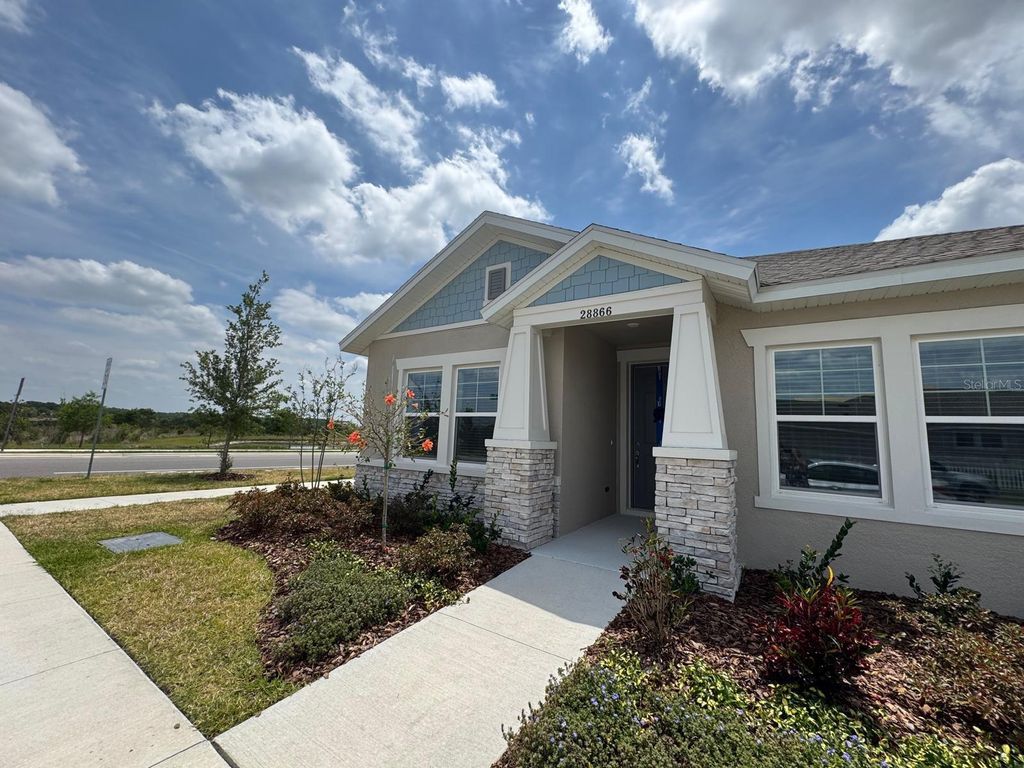 Photo of 6218 Wandering Willow Drive, Wesley Chapel, FL 33545 (MLS # TB8425125)