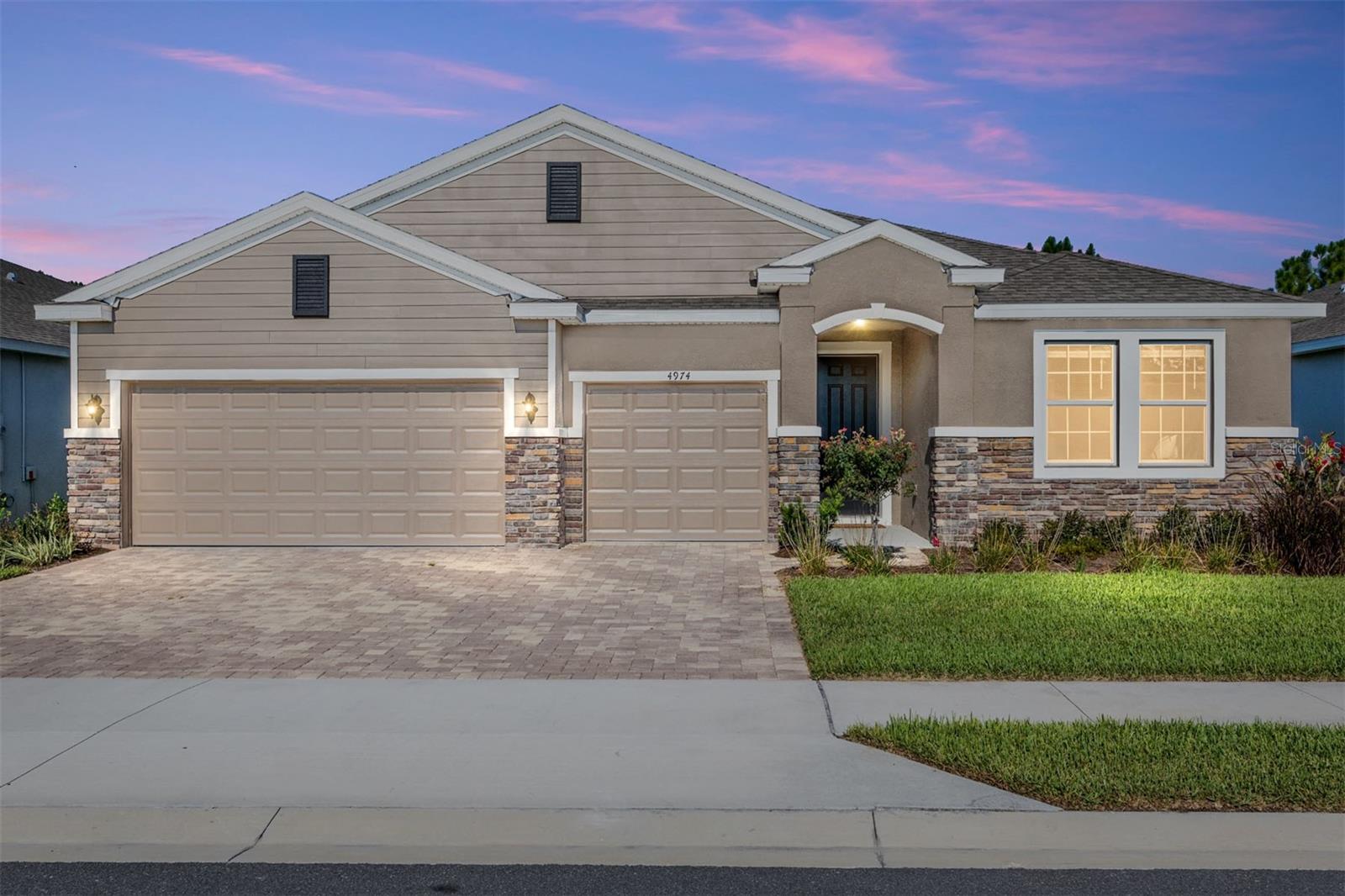 This meticulously maintained custom built Camden Model is truly ONE OF A KIND! Located in the highly sought-after gated community of Ocala Preserve, just minutes from the renowned World Equestrian Center! Located ON THE GOLF COURSE, this premium lot is the only one available! This spacious floor plan offers over 2,800 square feet of living space, including 4 bedrooms, 3.5 bathrooms and a 3-car garage —plus a multi-generational living space (in-law suite) for added flexibility! Perfect for families of all sizes. Located in the non-age restricted phase of Ocala Preserve! Less than a year old! No other Camden models are being built at this time ANYWHERE in Ocala! All the updates you want when you move into a newly built home have already been done for you! Over $50k worth of upgrades! Step inside to tall ceilings, natural light, and an open floor plan that flows effortlessly into an expansive open-concept great room. The perfect blend of luxury and comfort, in a light and airy atmosphere. At the heart of the home is a stunning chef's kitchen, featuring an oversized kitchen island, glistening granite countertops, custom solid wood cabinetry, new stainless steel appliances, and stunning views of the Golf course. With a formal dining space as well as café and island seating, you will have plenty of room to entertain. At the front of the home are two secondary bedrooms connected by a Jack-and-Jill bathroom. The third bedroom is more private with an en-suite bathroom, perfect for in-laws or guests as it is separated by a multi-generational living space inclusive of its own refrigerator and kitchenette! The Primary Suite is a true sanctuary, offering an expansive ensuite bathroom with a soaking tub, glass enclosed shower, dual sinks, and an oversized walk-in closet. Designed for indoor-outdoor living, beautiful large sliders invite you to a very private, oversized extended lanai—a tranquil haven perfect for entertaining! Enjoy your morning coffee, sunset cocktails, or hosting friends and family with spectacular Golf course views- NO REAR NEIGHBORS! From its luxurious upgrades to its attention to detail, this home is a rare find that perfectly blends sophistication with comfort. The HOA fee covers lawn and landscape maintenance, high-speed fiber optics internet, and membership access to all community amenities. These include both indoor and outdoor fitness areas, group fitness classes, 21 miles of dedicated walking and biking trails, bocce, horseshoe pits, tennis, pickleball, a fishing dock, kayaks, canoes, and a paddleboat. Not to mention the clubhouse, the 18-hole Tom Lehman-designed golf course, Salted Brick restaurant and day spa. This home is also available FULLY FURNISHED! TURNKEY!
