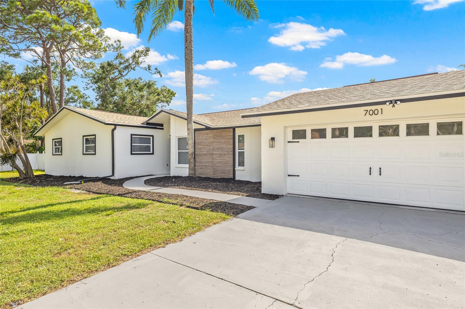 Welcome to your dream home in the coveted Historic Pink Streets neighborhood of South St. Petersburg-just minutes to Tampa Bay and minutes from vibrant downtown! This 2,115 sq ft, 4-bedroom, 2-bath pool home features quartz countertops, and designer gold fixtures that bring warmth and elegance to every room. Beautiful, vaulted ceilings. Brand-new upgraded large porcelain tile throughout. Enjoy outdoor living at its best with a large screened-in pool, expansive backyard that's perfect for pets, and lush privacy landscaping. Whether you're entertaining or unwinding, this backyard is your private oasis. Rest easy knowing the home features a 2025 water heater, 2020 roof, and 2018 AC. This home was not affected by any hurricane damage. Nestled in a quiet, walkable neighborhood near waterfront parks, docks, fishing spots, and the Skyway Bridge, with easy access to 1-275, top-rated schools, and downtown St. Pete's art, food, and cultural scene. Live the laid-back coastal lifestyle and walk to the Bay, dine Downtown or Lounge by the pool and don't miss this rare opportunity in one of St. Petes most charming and desirable areas. No HOA Priced below appraised value this home has built in equity. A copy of the appraisal report is available. A 4 point inspection and wind mitigation has been complete and available upon approved offer.
