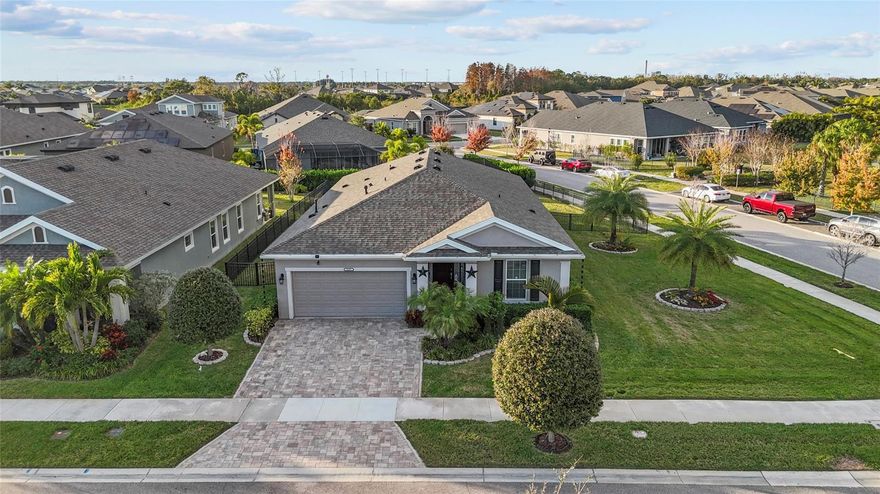 Welcome to this beautifully maintained 4-bedroom, 3-bath home offering 2,135 sq ft of modern living in the highly sought-after, resort-style community of Waterset in Apollo Beach. Perfectly positioned on a premium corner lot, this home offers extra privacy, additional outdoor space, and beautiful curb appeal from the moment you arrive.

Inside, you’ll find a bright and spacious open-concept floor plan with tile flooring throughout, providing a clean, elegant, and low-maintenance living experience. The gourmet kitchen features stainless steel appliances, solid wood cabinetry, ample storage, and a large island that flows seamlessly into the dining and living areas—ideal for entertaining family and friends.

This home offers a desirable split-bedroom layout, including a private en-suite bedroom with its own bathroom—perfect for guests, in-laws, or older teens. Every room is generously sized, offering comfort and flexibility for any lifestyle.

Step outside to enjoy a fully fenced backyard and a screened-in lanai, creating the perfect space for morning coffee, evening relaxation, or weekend gatherings. Whether you’re grilling, playing, or simply unwinding, this outdoor area truly enhances Florida living.

Located in the award-winning Waterset community, residents enjoy unmatched amenities, including multiple resort-style pools, water slides, fitness centers, tennis and basketball courts, playgrounds, dog parks, scenic walking and biking trails, community events, and a beautiful clubhouse. 

With easy access to major roads—including I-75, US-41, and US-301—commuting to Tampa, MacDill AFB, Brandon, or St. Pete is quick and convenient. Shopping, restaurants, entertainment, schools, and beaches are all just minutes away.