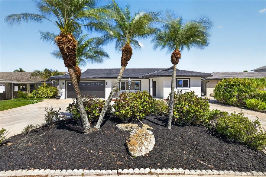 Beautifully updated 3 bedroom, 2 bath, 2 car garage,  1712 sq.ft. waterfront home in true move-in condition! Situated on a wide, deep water canal with highly desirable eastern exposure, this home offers peaceful sunrises and cooler afternoons with stunning water views. The screened-in pool creates the perfect setting for relaxing or entertaining while enjoying the serene waterfront backdrop.
A large yard provides ample space for outdoor living, pets, or future customization, while the circular driveway offers essential extra parking for guests and gatherings. The garage has been finished with durable and attractive epoxy flooring, adding both function and style.
Inside, you’ll find a light & bright open split-bedroom floor plan designed for comfort and privacy, along with beautiful water views from multiple areas of the home. The spacious all-new kitchen features stainless steel appliances, custom cabinetry and solid surface countertops offering ample storage and beautiful pool and water views from the large farm sink. Updates include new tile roof in 2006, new electrical panel; plumbing updates and more in 2025.   Located just around the corner from the open Gulf, this property is a boater’s dream.
Located in the r Gulf Harbors community, residents enjoy a golf cart-friendly neighborhood, optional private beach access, and close proximity to downtown New Port Richey’s shops, dining, and events. This well-maintained neighborhood offers a strong sense of community and the perfect setting to enjoy the Florida waterfront lifestyle year-round.
Located in the sought-after Gulf Harbors community, with optional access to the exclusive Gulf Harbor Beach Club, this property offers a rare opportunity to own a well-built waterfront home with true direct Gulf access. Community is golf cart friendly ; historical Downtown New Port Richey is less than 4 miles away where you will find many restaurants and shops and Sim's Park which is an outdoor community venue that host various outdoor events such as festivals and concerts throughout the year. Come see this gorgeous waterfront home today and start living the Florida waterfront lifestyle today!