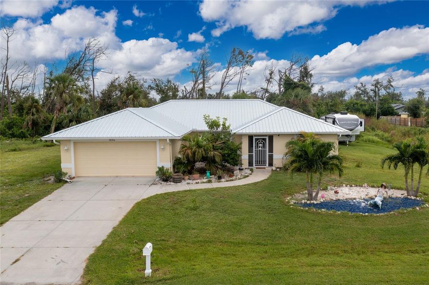 If you love wide open spaces, let this charming home nestled on a double lot in an X-Flood Zone welcome you to stay awhile! When you enter the home you will be invited into a spacious living room with a clear view of the lush green backyard through the sliding glass doors. To the left the recently updated kitchen features stainless steel appliances, granite countertops, stone backsplash, and new cabinetry. The dining room connects directly to the kitchen and enjoys ample natural light through both windows and additional sliding glass doors. The primary suite offers the space to create a haven of relaxation with more than enough room for king-sized bedroom set, and then some! In the primary bathroom you will find dual sinks and vanity with a walk-in shower and separate water closet. The two other bedrooms provide ample guest space, or room for additional storage. A screened in lanai runs along the back of the house and residents can take advantage Florida's year round climate and enjoy a fresh breeze throughout the home thanks to the entrances being fully screened. Residents can enjoy the additional piece of mind provided by the recently installed metal roof and provided hurricane shutters. There is no HOA on this piece of Florida paradise, so bring your boat, recreational vehicles, and more for unrestricted Florida living! Located close to beautiful Gulf beaches, world-class fishing, multiple golf courses, dining and entertainment, the time couldn't be better to make this property yours! Call today for your private showing!