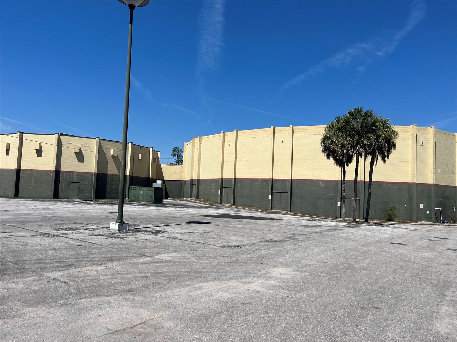 Here is a chance to own a piece of Ocala history. Was previously a movie theater and now currently houses a church but could be a multi-use office building on a large pie shaped piece of land with 94,000 SF of asphalt paving used for parking. It is accessible by either E Silver Springs Blvd or NE 7th Street. Two auditoriums with mezzanine offices. If the building does not fit your needs then the land has tremendous value.