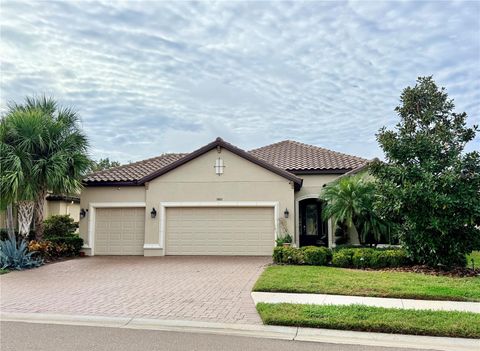 Photo of 10011 Wicker Park Place, Palmetto, FL 34221 (MLS # J995815)