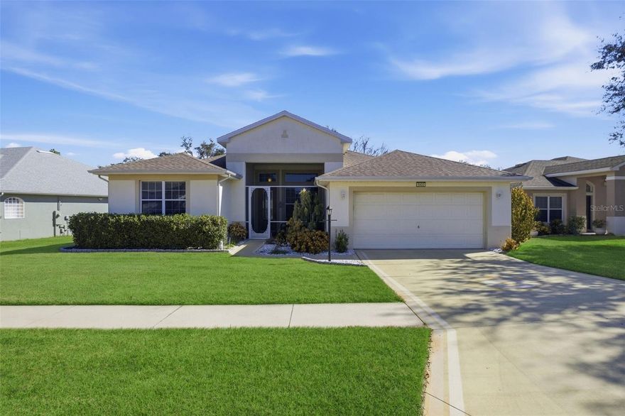 Welcome home to this light, bright, and beautifully maintained 3-bedroom, 2-bath residence in the sought-after Legacy of Leesburg, a premier 55+ gated community. Enjoy a rare oversized homesite with a peaceful backdrop—no rear neighbors as the property backs to the community’s walking park and a wooded area, creating a private, nature-filled setting.

Inside, you’ll love the no-carpet flooring throughout (easy to maintain and allergy-friendly) along with plantation shutters that add timeless style and let in just the right amount of Florida sunshine. The layout is comfortable and open, offering great everyday living and space to host friends and family whilst having privacy on your oversized lot.

Legacy of Leesburg is known for its resort-style amenities and active lifestyle, including a clubhouse, fitness center, pool, tennis/pickleball, social clubs, and a full calendar of community events—perfect for staying as busy (or relaxed) as you like.  We also have to mention the major renovations to the clubhouse and amenities.

Conveniently located in Central Florida, close to the turnpike so you’re within reach of Orlando’s attractions and dining, Disney, and area airports, making travel and day trips easy.  Straight down the road you can experience the hills & shopping that Clermont has to offer, as well as being opposite Pear Park for additional walking trails, pickleball and dog parks.

HOA fee includes many of the conveniences homeowners love — gated entry, lawn/grounds mowing/blowing & edging as well as cable, internet and RV boat storage plus community amenities.

New roof was installed in 2019. Furniture may be included (with acceptable terms), making this a great option for a smooth, move-in-ready transition.