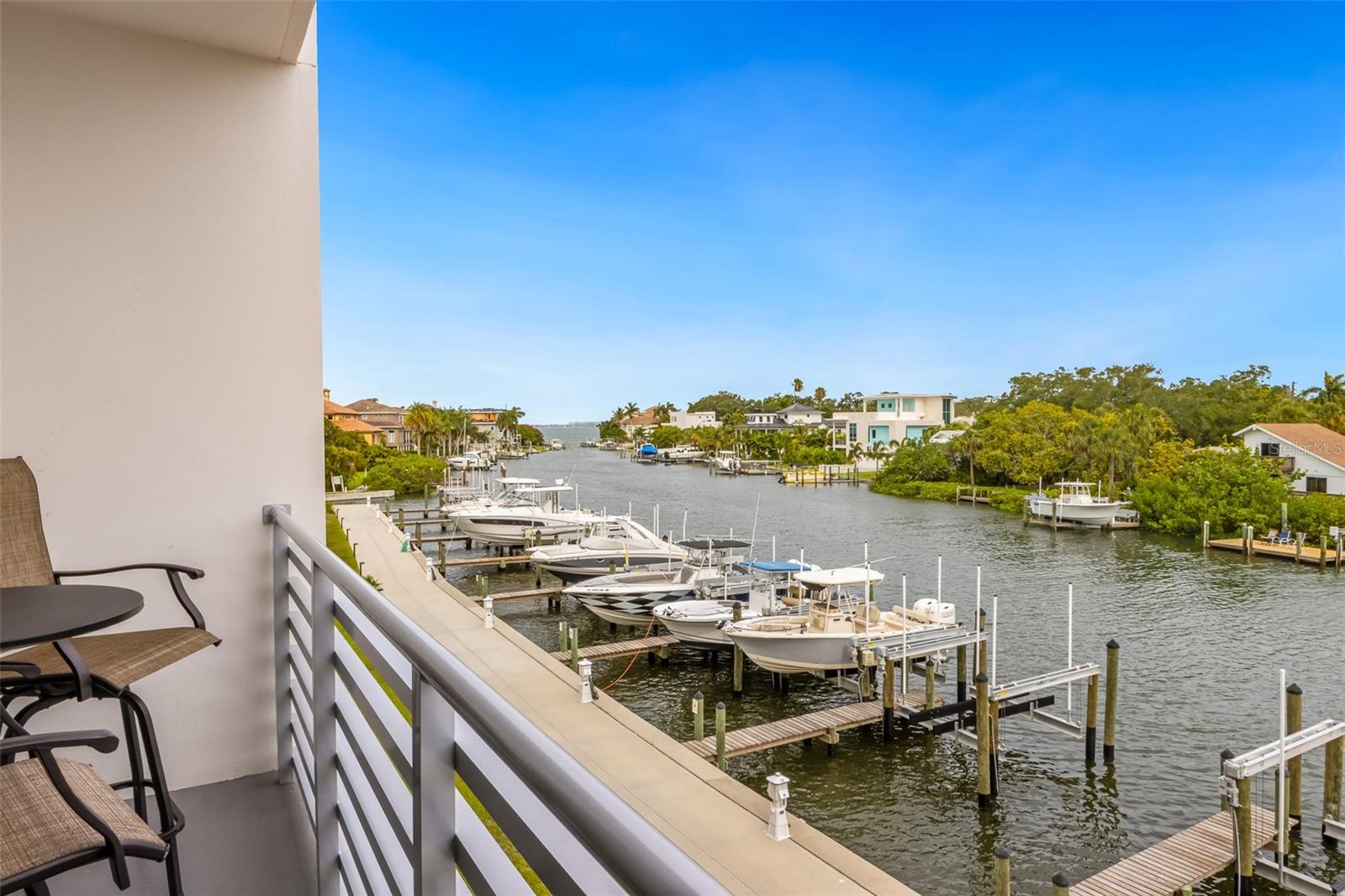 Welcome to The Strand, where luxury living meets waterfront paradise! This exclusive community boasts 152 exquisite condos, offering an unparalleled lifestyle with direct access to Sarasota Bay and the Gulf of Mexico. With 47 private boat slips, you can indulge in endless boating adventures right from your doorstep. Step inside and be captivated by the perfect combination of designer upgrades and breathtaking water views. This gated neighborhood ensures your privacy and security while providing a five-star living experience. The Strand is renowned for its outstanding amenities, providing a resort-style atmosphere for residents to enjoy. Take a dip in the heated swimming pool/spa, unwind in the fitness center, or gather with friends around the gas fire pit and grills. With a boardwalk and kayak launch & storage, adventure awaits just steps away. Beyond the comforts of The Strand, you'll find yourself in close proximity to Downtown Sarasota and its vibrant beaches. Immerse yourself in the city's rich culture, explore the local restaurants, cafes, and bars that are mere moments away. Whether you're seeking a primary residence, a second home, or an investment property, The Strand caters to your needs. Weekly rentals are permitted, offering an excellent opportunity for generating income. Pets are welcome and the community has it's own dedicated dog park. Additional features include an EV Charging Station, Deeded Storage Unit, and a premium under-building parking spot. Indulge in the splendor of nightly sunsets over Sarasota Bay or take a leisurely stroll along the bayfront—the possibilities are endless when you call The Strand home. Don't miss your chance to experience the pinnacle of waterfront living.