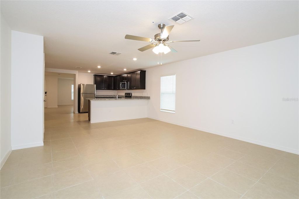 Photo of 1661 Hideaway Flat Street, Mascotte, FL 34753 (MLS # O6357099)