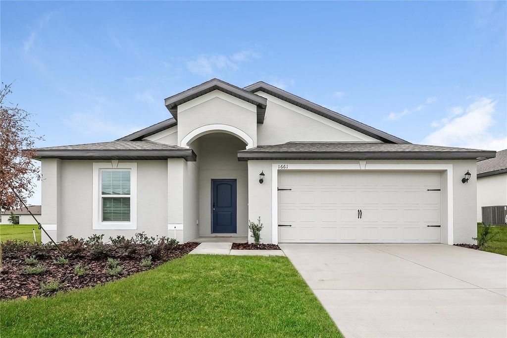 Photo of 1661 Hideaway Flat Street, Mascotte, FL 34753 (MLS # O6357099)