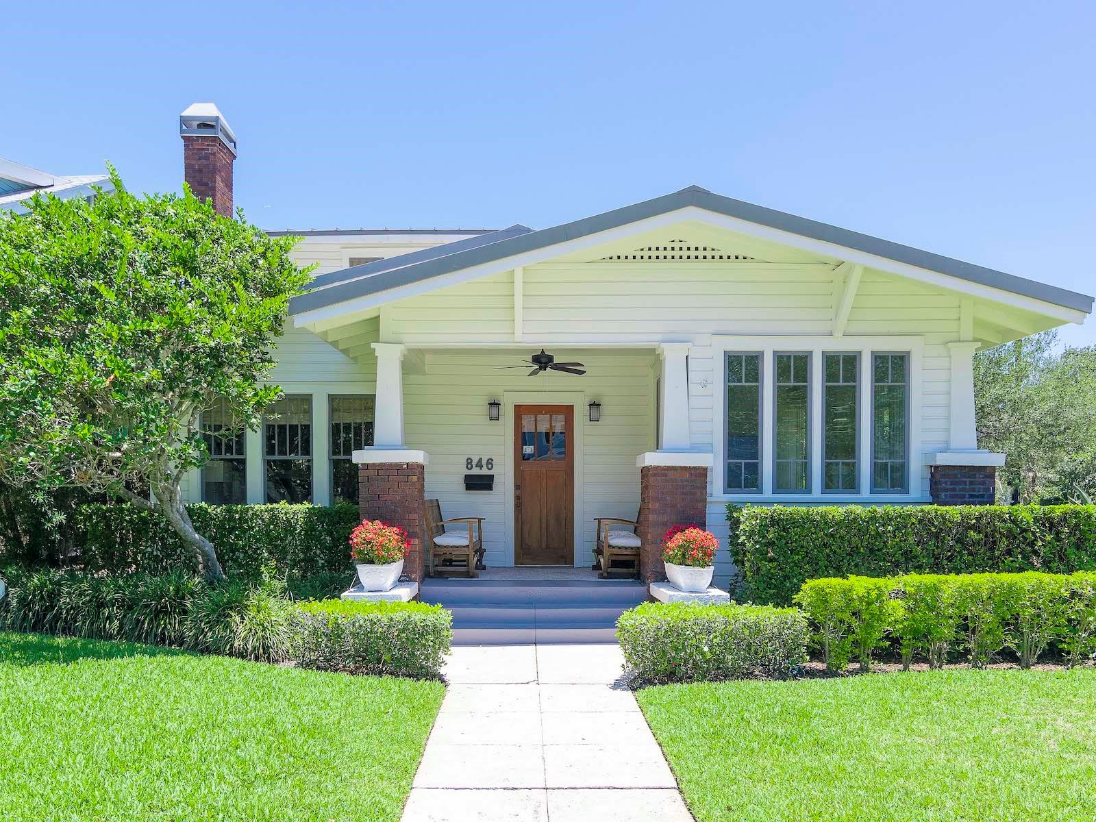 Under contract-accepting backup offers. In the Heart of Hyde Park's Golden Triangle, just 2 doors off Bayshore Blvd, sits this corner lot classic camelback Bungalow and detached Carriage house with convenient alley access. An interior "down to the studs" renovation was done on both the main house and carriage house in 2011. Heated square footage for the main house is 2280 and 324 for the upstairs carriage house. Upon entering the home you will find beautiful heart of pine floors and an easy living floor plan. From the front sunroom windows views of Bayshore and the bay can be seen. The large living room, with gas plumbed fireplace, flows into a dining room. Arts and Crafts open columned built-ins add the perfect balance to the living area. The custom chefs kitchen is beyond the dining room. Handmade hardwood furniture grade cabinetry is accented by Mystery white marble countertops, Thermador appliances, and entertaining island. The gas cooktop comes with a down draft. The First Floor Master Bedroom has wonderful natural light and is en-suite. There is also a second bedroom on the first floor, as well as a laundry room and half bath. Upstairs are 2 additional bedrooms and a full bath, with the AC on this level under 5 years old. Lush mature landscaping makes the backyard your private in town oasis, and there is plenty of room should a pool be in your future. The natural edge large piece slate walks continue to the covered loggia attached to the Carriage house. There is alley access for the garage, while the spa like second floor has a breakfast bar, full bath, and the property's fifth bedroom. The Carriage house AC system is only a year old. Both structures on the property have standing seam metal roofs for long term benefit. Gorrie Elementary is less than a 10 minute walk, while Wilson Middle School is 2 blocks away. Hyde Park Village is also under a 10 minute walk, with restaurants, coffee shops, shopping and more. Forbes Best Places to Live in the U.S. listed Hyde Park as one of the 10 Best Neighborhoods. Be a part, and in the Heart of everything Tampa Bay has to offer. Make an appointment today to see this special home.