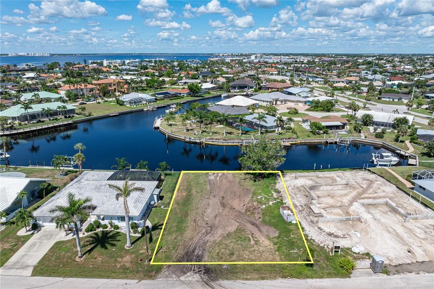CALLING ALL BOATERS! - Now's your chance to build your dream home here...on this prime waterfront lot in Punta Gorda Isles w/fantastic basin view plus 80ft of seawall & very quick, deep water, sailboat access to Charlotte Harbor. Reach open water in mere minutes. Lot is located in heart of original sailboat section of PGI & is surrounded by a mix of older & newer, custom-built homes. Property offers city water & sewer. Perfect spot for your custom home. Lot dimensions for the property are 90x120x82x120. The rectangular shape is ideal for placing most local builder models right on lot with a 3-car garage. The additional 10ft of width on the street side adds even more room. Enjoy some of the best fishing & boating in SWFL from your backyard. Property was the location of a previous home which translates into possible reduction of thousands of dollars of impact fees & fill savings. Claim your spot in paradise today! Close to everything - walking distance to Isles Yacht Club, Fishermen's Village & historic downtown.