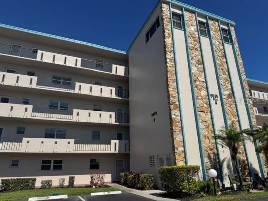 Perfectly located in the heart of Bradenton within the Golf Community of Ironwood, this lovely unit immediately greets you with a spacious open floor plan and a beautiful lanai with tile floors overlooking the stunning golf course and tropical landscape. The open kitchen features newer laminate flooring throughout the unit. The nicely sized master bedroom boasts amazing views of the golf course. The main bathroom features a brand new vanity and flooring, a walk-in shower, and a generous walk-in closet, as well as a second closet. The balcony can also be accessed through the main bedroom. A second half bathroom is an added bonus. Enjoy your morning coffee while taking in this peaceful and breathtaking view. This well-appointed unit comes completely furnished and includes a storage unit and an assigned parking space. The laundry room and elevators are conveniently located nearby. Ironwood amenities include a community heated pool, a clubhouse available for parties and events, a fitness room, a kitchen for catering, a ping-pong table, and an outdoor grilling area. Golf membership is available for long-term or daily use. Owners and guests can also attend events within the community. Ironwood is just a short drive from restaurants, shopping, movie theaters, public parks, and is only 6 miles from Anna Maria Island. Set up a private showing today!