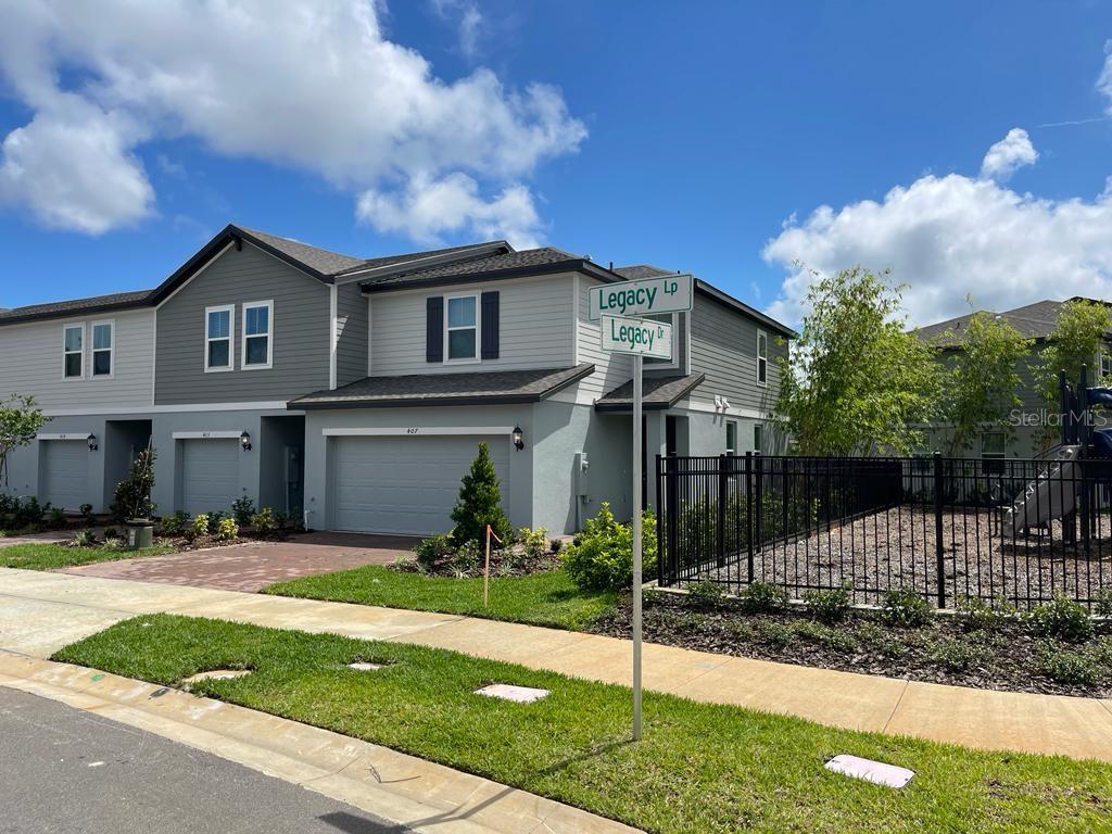 Photo of 407 Legacy Loop, Davenport, FL 33896 (MLS # O6427736)