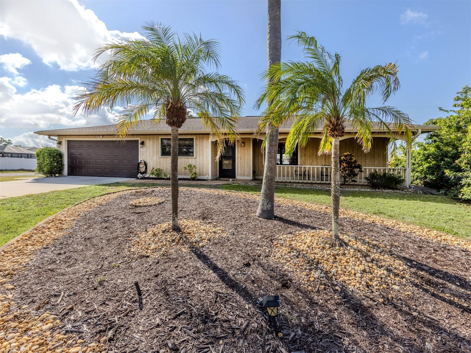 Welcome to this adorable turnkey bungalow on a corner lot in the heart of South Venice! With its welcoming long front porch, this three-bedroom, two-bath home exudes classic Florida charm and offers a functional, quirky floor plan that's ideal for easy living and entertaining. Go inside to a light-filled great room with soaring pitched ceilings, creating an airy and spacious feel from the moment you walk in. The open-concept kitchen has a galley-style layout, complete with a cozy breakfast corner, a drive-up bar window with seating, and a separate dining area that opens directly to the back lanai, your spot for relaxing outdoors. The home features no carpet throughout, making it easy to maintain and ideal for Florida living. The guest bedroom has private access to the guest bath, which also opens to the kitchen, making it super convenient for visitors. Enjoy peace of mind knowing this home is located in an X flood zone, there was no hurricane damage according to the owner, and appreciate recent upgrades like the new water softener and reverse osmosis system in the kitchen. Residents of this friendly community have the option to join the South Venice Civic Association for a nominal fee, which includes access to a private community boat ramp and ferry service to a secluded beach, a unique perk that adds tremendous value and lifestyle appeal. Whether you're looking for a full-time home, seasonal retreat or vacation rental, this bungalow checks all the boxes. Quirky, cozy, carpet-free and full of charm, this one’s a must-see!