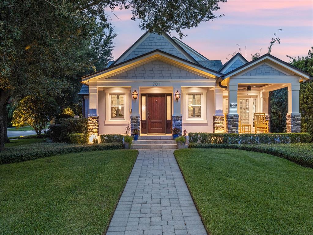 What a property! Stunning Capecod style urban estate located in downtown Orlando. This 5 bedroom 4.5 bathroom custom pool home was completely rebuilt and expanded in 2008/2009. Wonderful resort style living in the heart of the city offers the best of both worlds! This home takes full advantage of the large CORNER LOT location with GORGEOUS VIEWS OF THE LAKE AND 2 CITY PARKS. Enjoy Florida at its finest with a saltwater pool, spacious covered lanai with outdoor summer kitchen, pool bathroom and an outdoor shower. This home also features a electronic driveway gate, paver drive and side-entry 3-bay garage topped by an apartment/guest quarters. In the main house, you’ll find superior craftsmanship and attention-to-detail, from the hardwood floors, custom millwork & plantation shutters, to a gas fireplace and timber beam accents. The living room is beautiful with wood beams, stone fireplace and custom built-in bookshelves that lead to an intimate dining room. The kitchen was updated in 2019 and features travertine floors, pro-style appliances, dolomite countertops, a walk-in pantry and a center island with breakfast bar and pendant lighting. The great room is massive, full of light and perfect for entertaining! The kitchen and the adjacent great room open to a backyard oasis. Here you’ll find the covered lanai with a gourmet outdoor kitchen with plenty of room to dine & entertain, plus the fantastic salt-water resort style pool and above ground spa. The separate carriage house (or income suite) with over 900 sq. ft. is located above the garage and has an open floorplan and all the same finishes found in the main house. The space includes a private bedroom and bathroom with walk-in closet, as well as a spacious living room & full kitchen with a breakfast bar. Back in the main house, the stunning master suite boasts a private study/den overlooking Lake Davis. Newly remodeled in 2021, the large master bathroom features a custom-porcelain tiled wet room with heated floors, 2 separate vanities with quartz countertops, a free-standing modern concrete soaking tub, double rain-head shower with a frameless enclosure and a walk-in closet with boutique-style custom built-ins. The second floor offers a spacious ensuite bedroom with walk-in closet, as well as two additional bedrooms with a Jack and Jill bathroom. Enjoy movies in the large theatre room with wet bar, or utilize this great flex space for an exercise or game room. Even better is a cozy reading nook library, perfect to curl up with a good book or enjoy a quiet meditation space. This spacious home will stay comfortable year-round, as it comes with energy-efficient A/C units 2015 and 2017, Windows replaced in 2014, as well as a whole-house generator 2017. This property is ideally situated across from both Lake Davis and Cherokee Park. It’s very close to the countless cultural and entertainment options downtown, the 408 and I-4. Great public schools zoned for Blankner K-8th and Boone HS. Come see this spectacular property today!