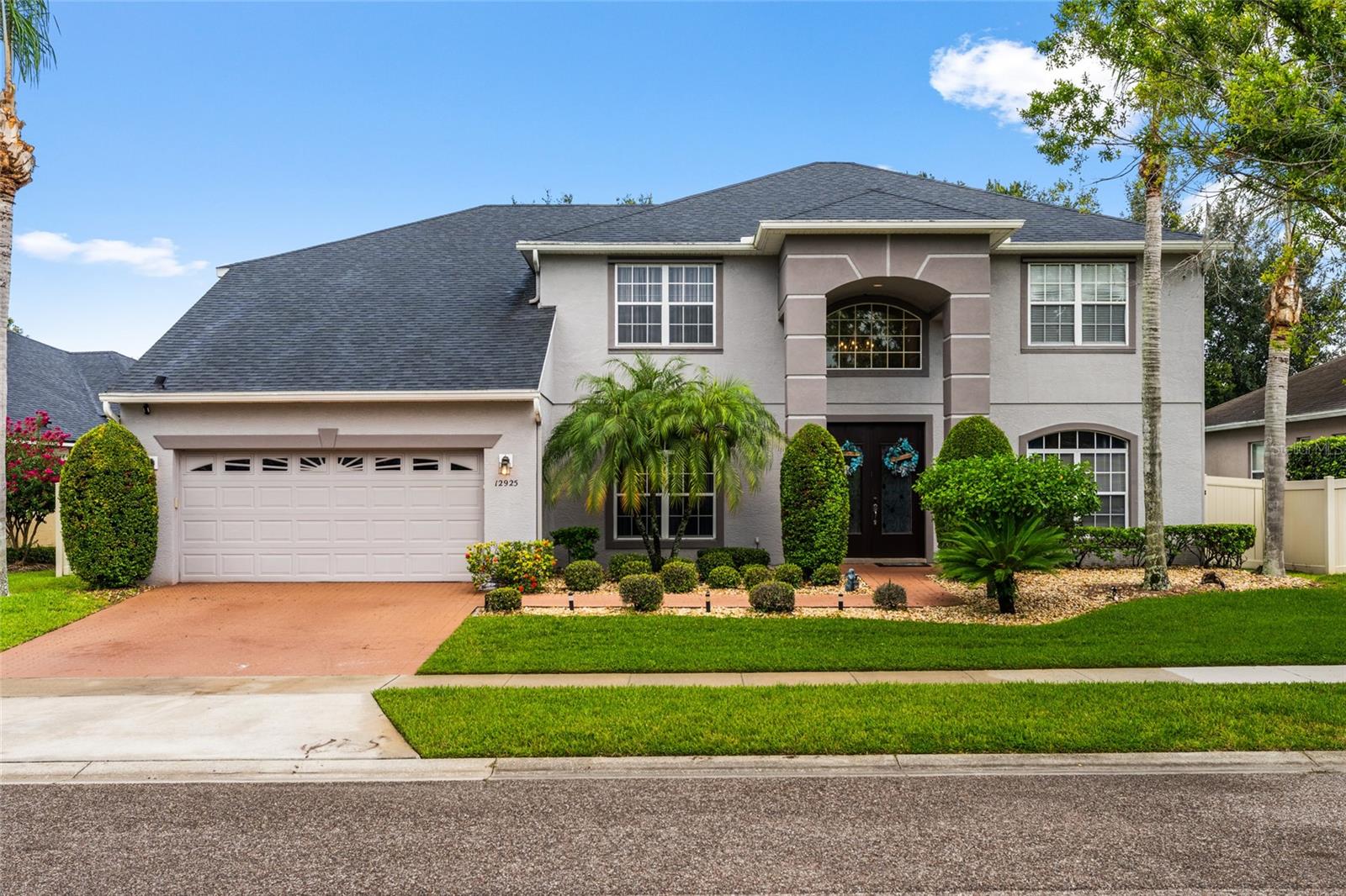 Welcome to 12925 Islamorada Drive. Here’s your chance to own a truly remarkable home in the highly sought-after Flora Vista neighborhood of Hunters Creek. Nestled on nearly a ¼-acre lot, this spacious 6-bedroom, 3.5-bath residence offers both style and functionality. There are two conveniently located bedrooms on the main level and a layout designed for comfortable, care-free living. From the moment you step into the soaring, vaulted foyer adorned with a striking chandelier, you’ll be drawn in by the home’s elegance and open, airy design. The thoughtfully crafted floor plan provides generous living space that’s perfect for both everyday living and entertaining guests. The true highlight of this property is the exceptional backyard. It's your own private paradise. Enjoy the Florida lifestyle year-round with a screened-in, solar-heated saltwater pool, a covered lanai, and plenty of room to relax or entertain outdoors. Ideally located in a top-rated school district and just minutes from Town Loop’s dining, shopping, and conveniences. You’ll also enjoy easy access to Orlando International Airport and all of Central Florida’s world-class attractions. Recent upgrades include several hurricane-impact windows and sliding doors (2022–2024), new fence and pool heater (2021), both A/C units replaced in 2022, a water softener, solar panels, and a new roof installed in 2020. So much added value, efficiency, and peace of mind. Don’t miss this exceptional opportunity to experience the best of luxury living in one of Hunters Creek’s premier communities. Schedule your private tour today!