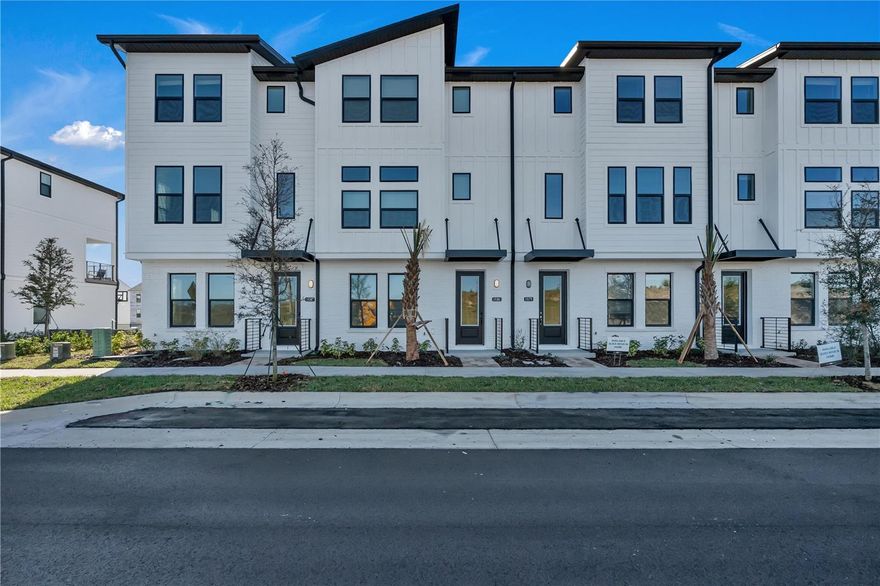 Brand-new 3-story townhome available for lease in Parkview at Hamlin, Winter Garden. This property features 3 bedrooms, each with its own full private bathroom, plus a half bath on the main level. Approx. 2,072 sq. ft. with an open-concept living area, high ceilings, and a gourmet kitchen with large island and upgraded finishes. Rear-entry 2-car garage provides private parking. Rent includes high-speed cable and internet. Located within walking distance to Hamlin Town Center shopping, dining, and entertainment, and near Hamlin Elementary and Middle Schools (zoning for Horizon High School – tenant to verify with OCPS). Outdoor recreation includes West Orange Trail access, parks, and community green spaces. Available for immediate move-in.