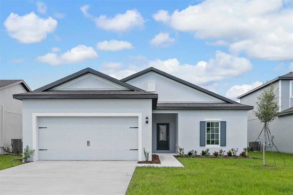 Photo of 13218 Tula Loop, Astatula, FL 34705 (MLS # TB8550916)