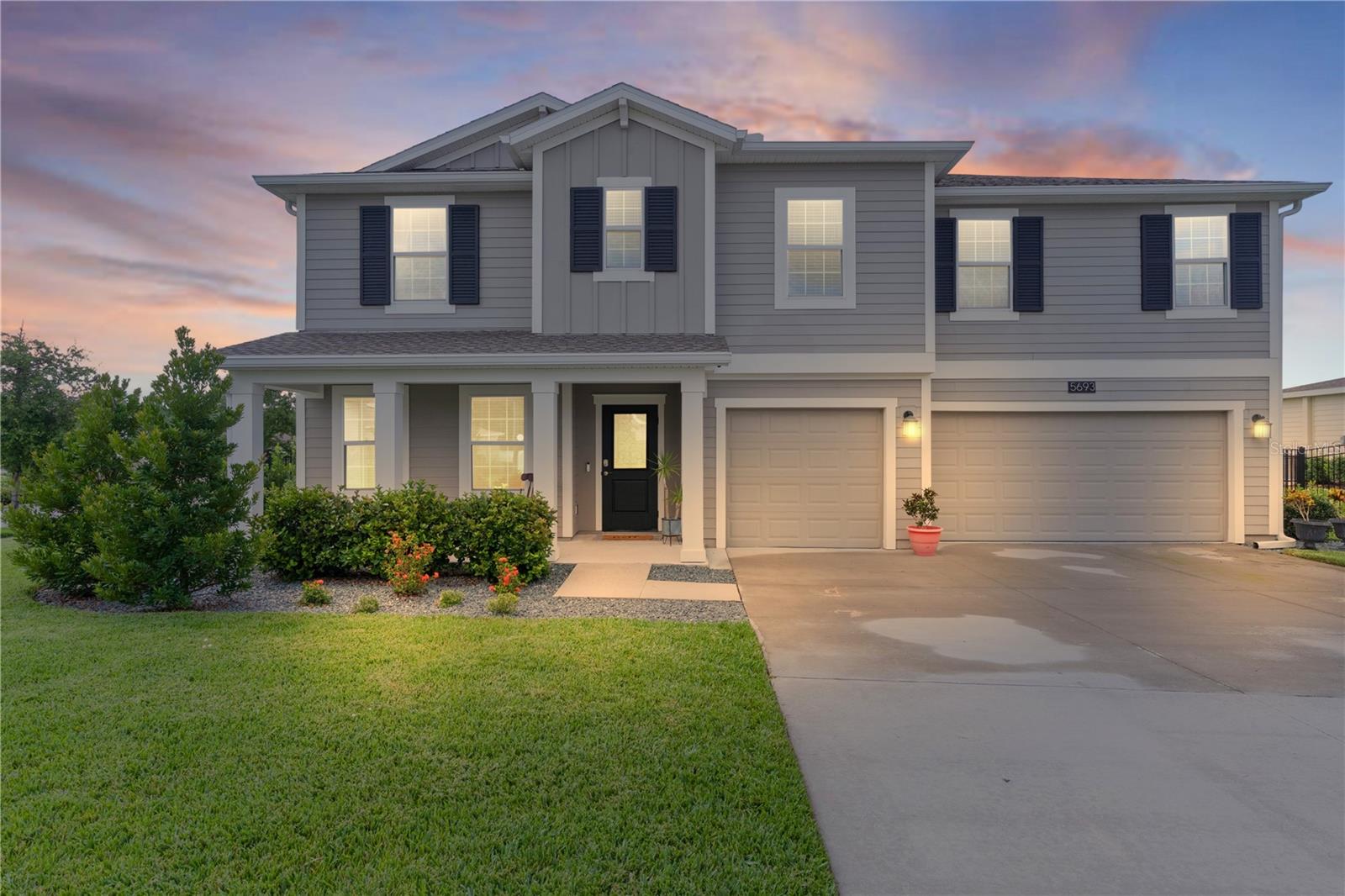 Welcome to your dream home in the highly desirable, guard-gated community of Stoneybrook Hills! Located on a spacious corner lot, this beautifully maintained 5-bedroom, 4-bathroom home is truly move-in ready and packed with upgrades, charm, and thoughtful details throughout.
Step inside to discover a flexible and inviting layout designed for both comfort and function. A front room with elegant double glass doors features a custom built-in bookshelf, making it the perfect space for a home office, study, or library. The open-concept living room features stylish tile flooring and flows seamlessly into a stunning designer kitchen, which boasts silestone countertops, GE appliances, a custom tile backsplash, and a massive walk-in pantry. Fine fixtures and finishes throughout add to the home’s modern appeal, including new light fixtures, ceiling fans, and chandeliers that brighten every room with style.
Downstairs, you'll find a spacious bedroom and full bathroom, perfect for guests or multi-generational living.
Upstairs, you’ll find an expansive bonus/family room, ideal for entertaining or unwinding. The luxurious primary suite includes a large glass-enclosed shower, his and hers vanities, and an oversized walk-in closet. A guest suite with its own private bath, two additional generously sized bedrooms with walk-in closets, and a conveniently located laundry room complete the second floor.
This home is filled with premium upgrades that truly set it apart. The completely fenced-in backyard offers both privacy and tranquility, enhanced with newly added podocarpus trees along the fence line. A large birdcage screened patio with an added BBQ-ready cooking space and new French doors with built-in blinds provides an ideal setting for outdoor dining, entertaining, or enjoying the Florida breeze.
You’ll immediately notice the gorgeous custom woodwork framing the doorways and entryways throughout the home—crafted with precision and care to elevate the overall aesthetic. In the dining room, a striking custom accent wall adds warmth, dimension, and character, creating a unique focal point that enhances the heart of the home.
Additional features include gutters installed on the entire home, an extra-large three-car garage for all your storage and hobby needs, a newly designed outdoor trash area to keep bins discreetly tucked away, and solar panels to help keep energy costs down.
Stoneybrook Hills offers a resort-style lifestyle with amenities including a sparkling pool with splash pad, fitness center with a family viewing/play area, tennis and basketball courts, baseball field, playground, clubhouse, and a 24-hour manned gate for added security. Just minutes from Downtown Mount Dora, with easy access to US-441 and FL-429, this location makes commuting to Orlando and surrounding areas a breeze.
Don’t miss the opportunity to own this exceptional home in one of Mount Dora’s most sought-after communities. Schedule your private tour today!