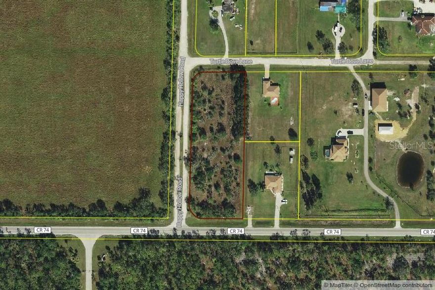 Beautiful parcel in Oaklea subdivision. Over 2 acres perfect for building your dream home with plenty of privacy. Corner parcel gives you the option of situating your home on Bermont Rd, Turtle Dove Lane or Happy Hollow Rd. Property is not overgrown and give you trees to create your landscape. Centrally located to EVERYTHING...US-41, I-75, schools, plenty of grocery & retail shopping, and dining. Near the new waterfront oasis, Sunseeker Resorts. Convenient access to a multitude of golf courses, world-class fishing, boating, and stunning Gulf beaches!