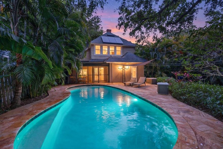 Enchanting Woodlawn Circle Pool Home - High & Dry in One of St. Pete’s Most Beloved Neighborhoods. Welcome to a home that feels like a storybook—where timeless Craftsman charm meets thoughtful, modern living in one of St. Petersburg’s most coveted enclaves. Perfectly positioned on a generous 110x65 lot in the high-and-dry, non-flood zone of Woodlawn Circle, this beautifully preserved and extensively upgraded residence offers both peace of mind and an elevated lifestyle. From the moment you arrive, the home sets the tone. Original architectural archways, gracefully draped in fragrant jasmine, create a warm and inviting first impression—hinting at the character and care found throughout. Step inside and you’ll find rich, solid heart-of-pine floors flowing seamlessly through the home, grounding the space in authentic craftsmanship while complementing the light, airy feel. This three-bedroom, two-bathroom home has been meticulously maintained, with nearly every major system thoughtfully upgraded for modern comfort and efficiency. Brand new hurricane-impact windows, doors, and sliders provide security and serenity, while a newer HVAC system ensures year-round comfort. Adding to the home’s efficiency is a fully paid-off solar system—delivering impressively low energy costs and sustainable living. But the true magic happens outdoors. Designed for effortless indoor-outdoor living, the backyard is your own private resort. A stunning Italian travertine deck surrounds a newer saltwater pool by Oasis Pools, creating a luxurious yet relaxed tropical escape—perfect for entertaining or unwinding under the Florida sun. Whether hosting sunset gatherings or enjoying a quiet morning swim, this space is simply unforgettable. Adding both function and flair, the two-car detached garage features sleek epoxy floors and custom auto screens—ideal for storage, hobbies, or even a flex workspace. Location? It’s everything. Woodlawn Circle is known not only for its charm and sense of community, but also for its rare elevation—offering peace of mind while still being just minutes from the energy of Downtown St. Pete. In under five minutes, you can find yourself exploring vibrant restaurants, waterfront parks, and cultural hotspots. Daily conveniences are just around the corner with Trader Joe’s, Fresh Market, and Whole Foods nearby, while the Gulf Coast’s world-renowned beaches are only a short 20-minute drive away. This is more than a home—it’s a lifestyle defined by character, comfort, and connection. Come experience the story for yourself.